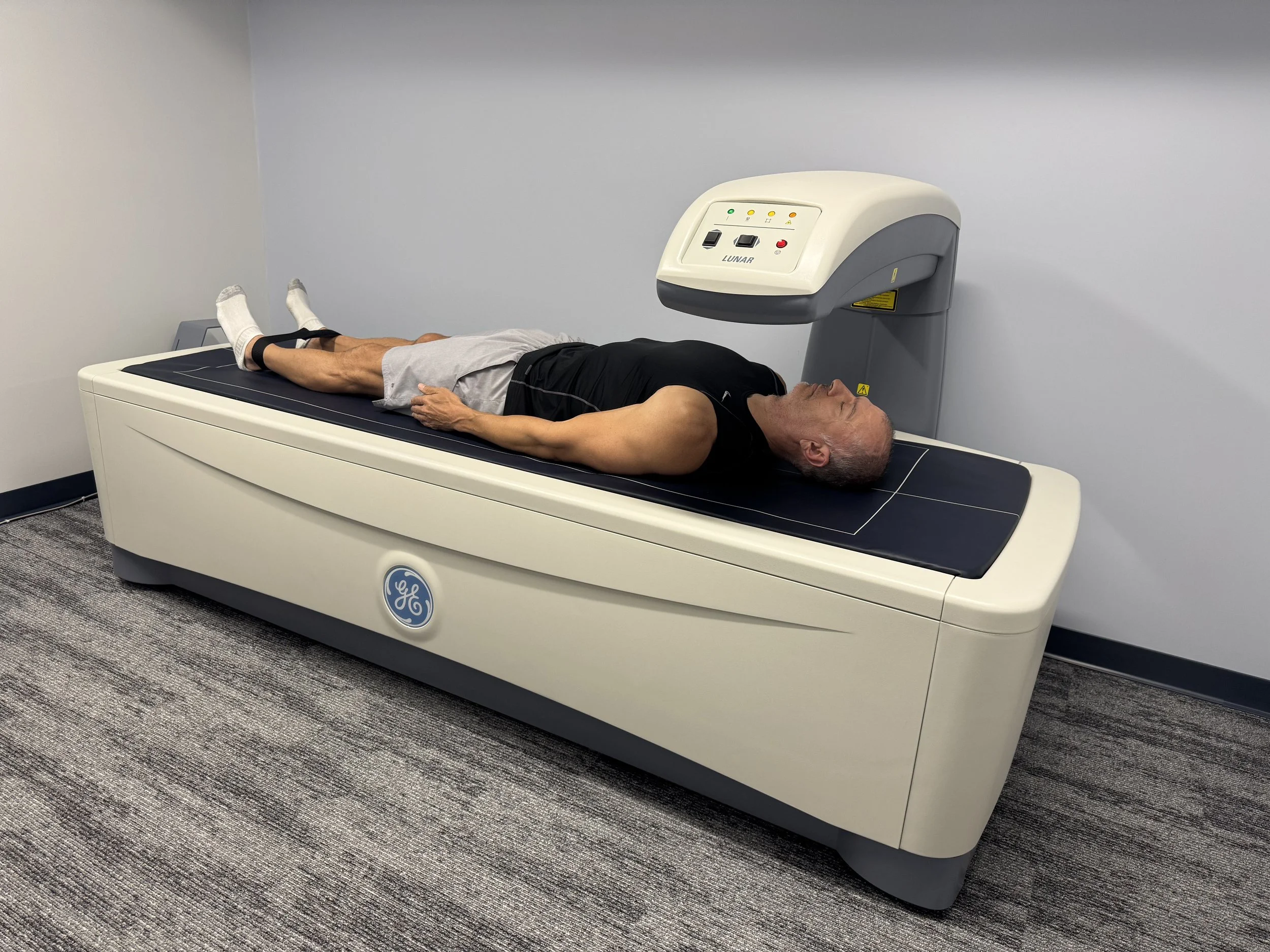 Young man during DEXA scan at DexaFit