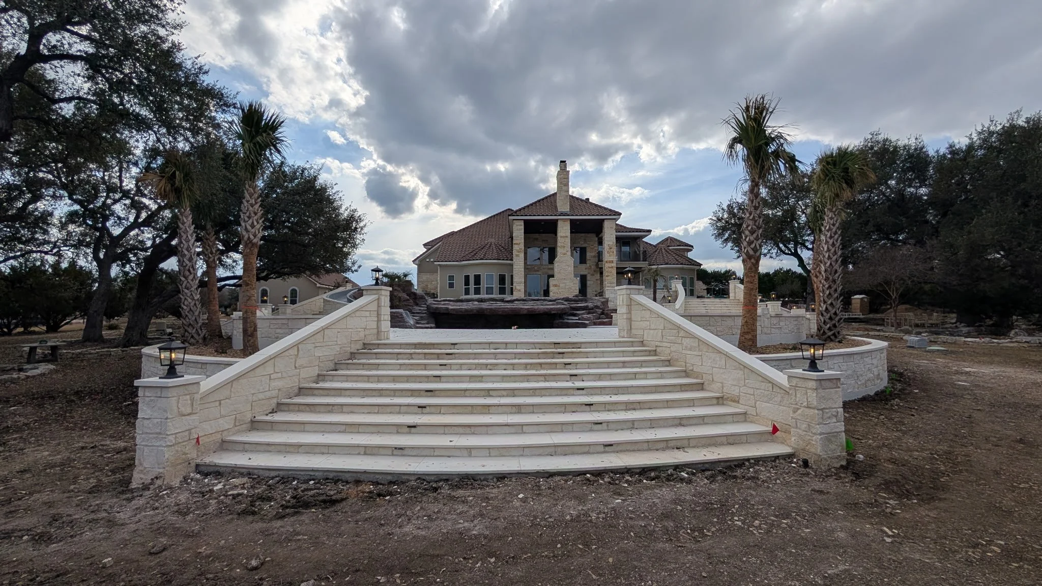 Exterior lighting on an extravagant stairway at a large home installed by BP Electrical Services
