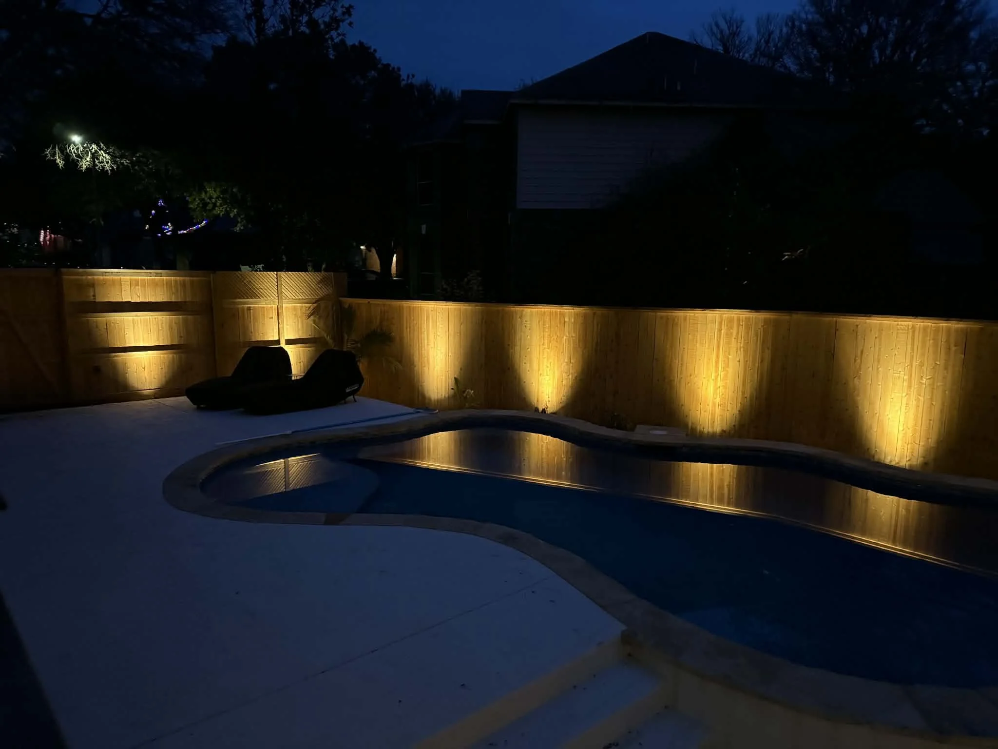 Exterior lighting around perimeter of residential fence, installed by BP Electrical Services