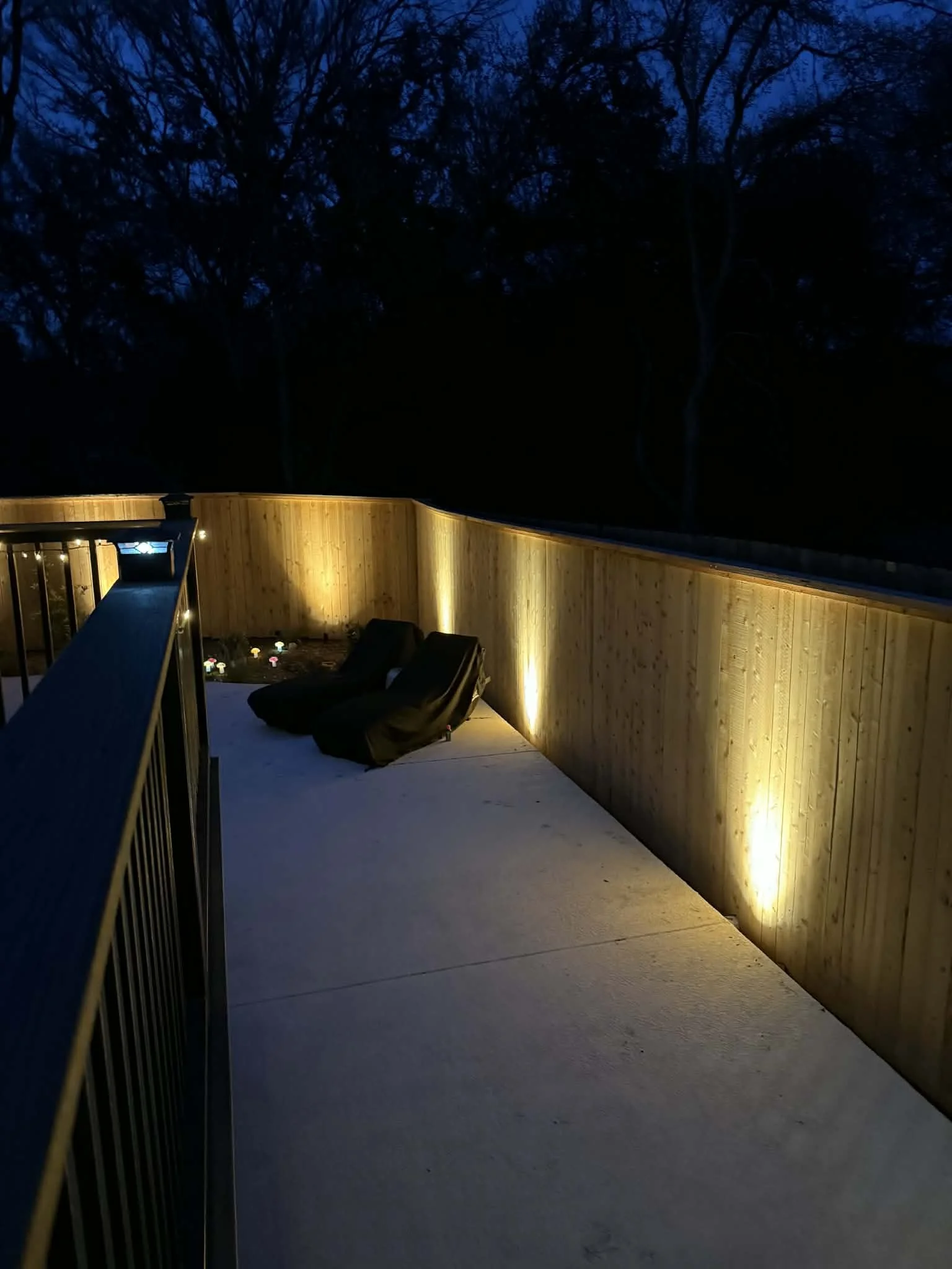Exterior lighting around perimeter of residential fence, installed by BP Electrical Services