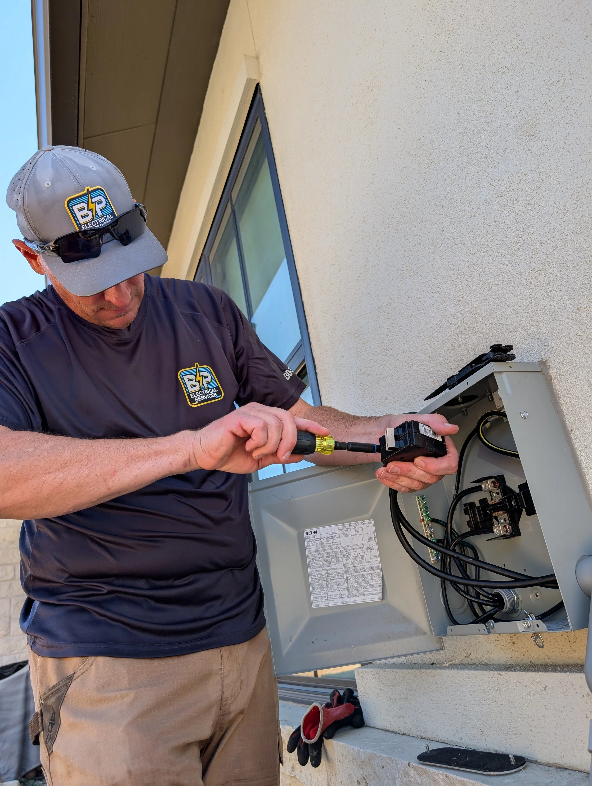 Jason Payne, New Braunfels, TX-based electrician, works on a residential electrical project.