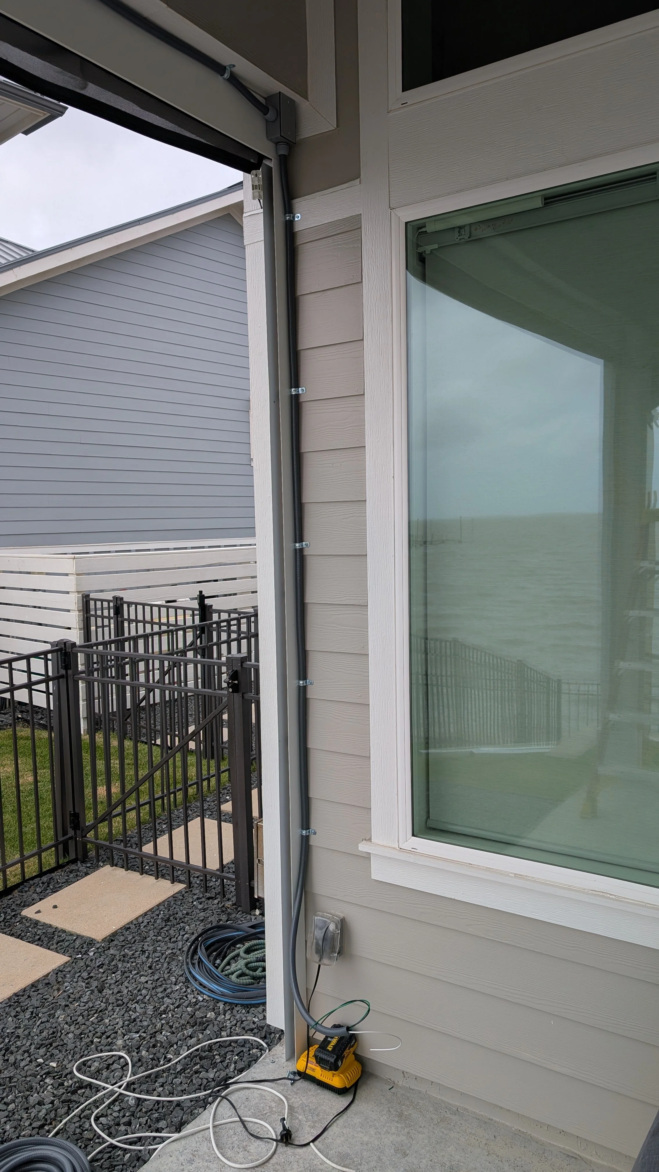 Exterior electrical wiring on a back porch installed by BP Electrical Services