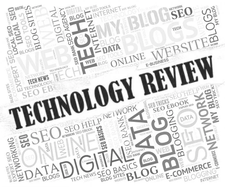 A group of five diverse people in a meeting room with laptops, notebooks, and a coffee mug, discussing a project.