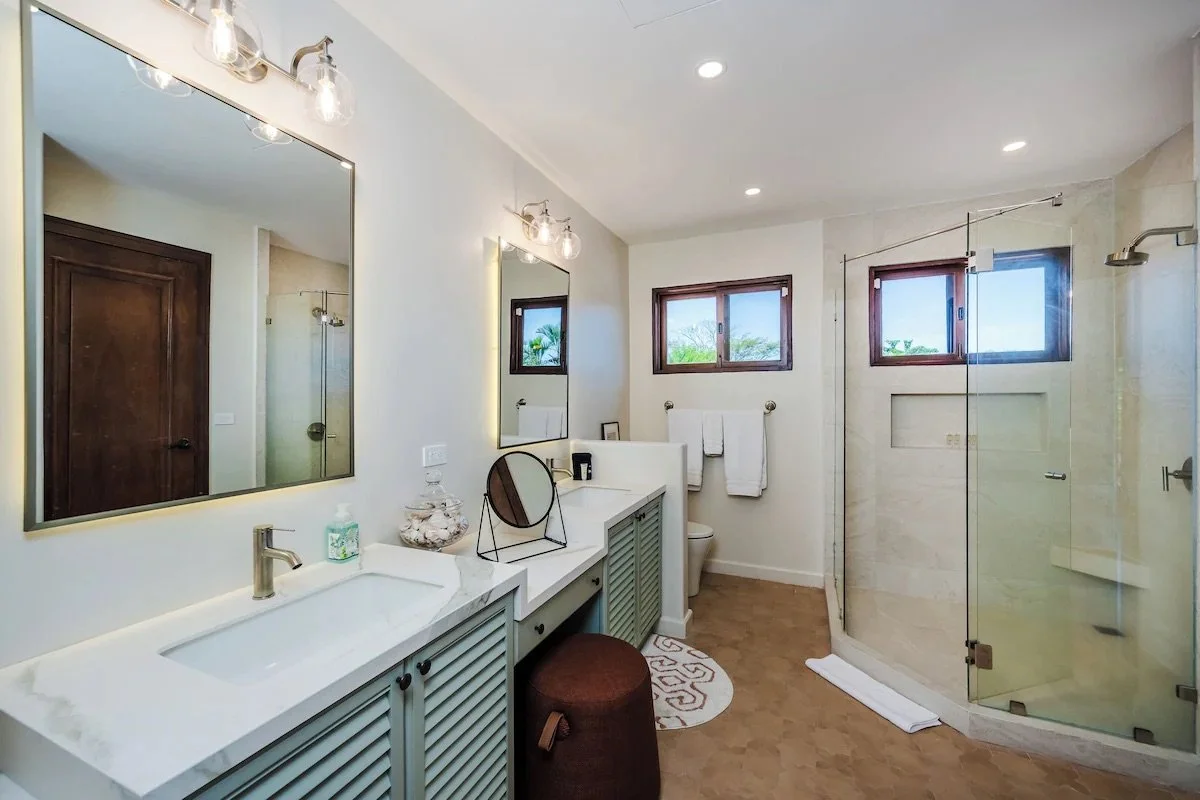 Double vanity, plenty of lighting, make-up table and large walk in shower