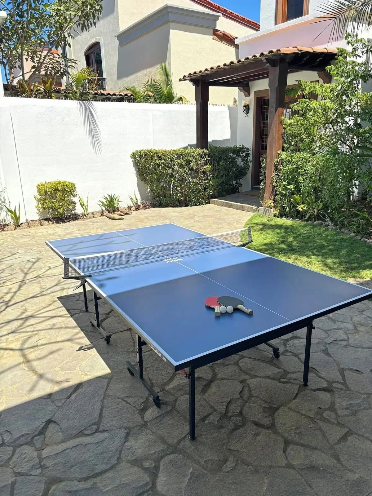 ping pong, wheeled table can be pulled out of garage in the front courtyard