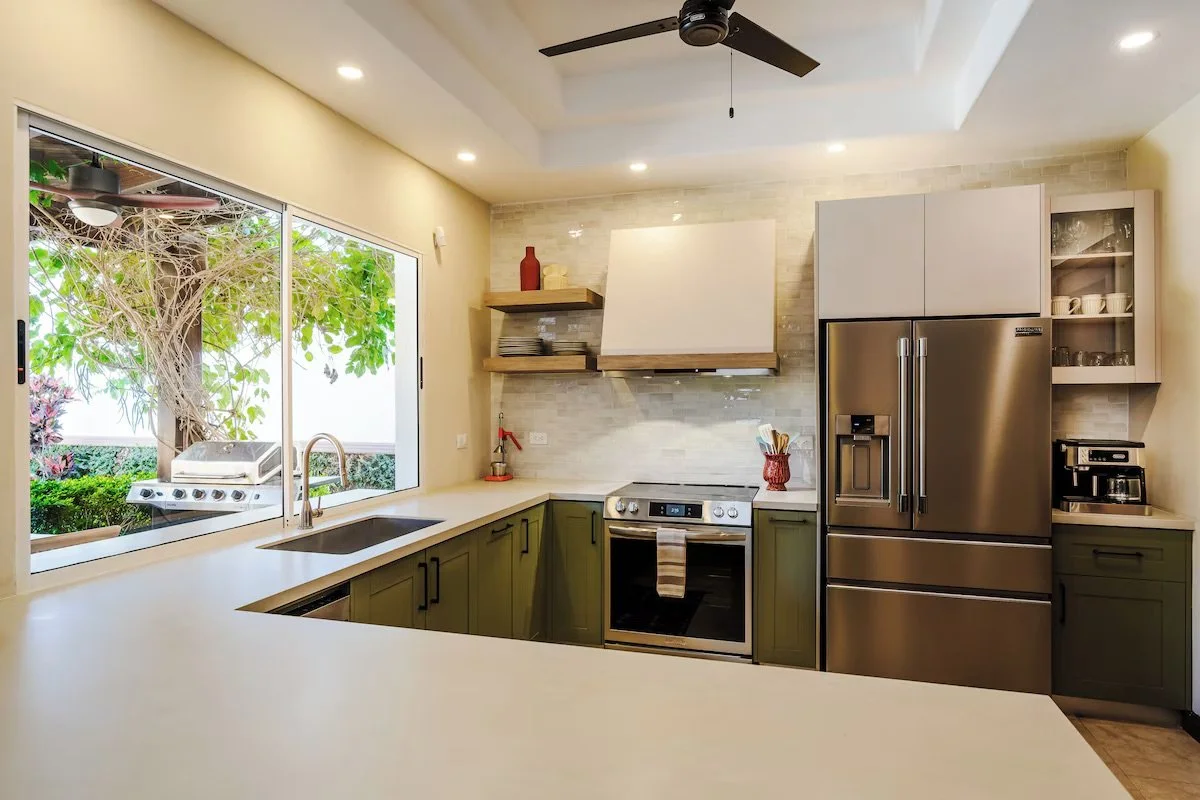 The recently renovated custom kitchen with pass through bar window