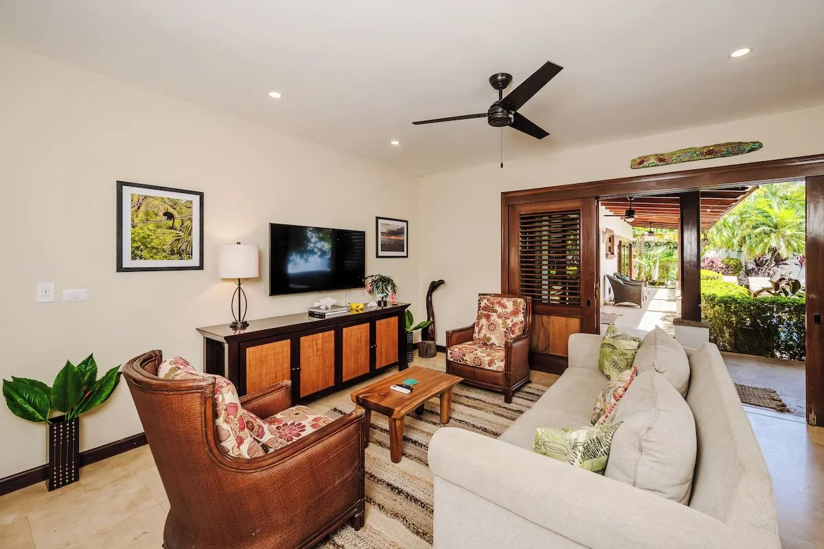 Living room with smart tv, games cabinet and pull out queen bed