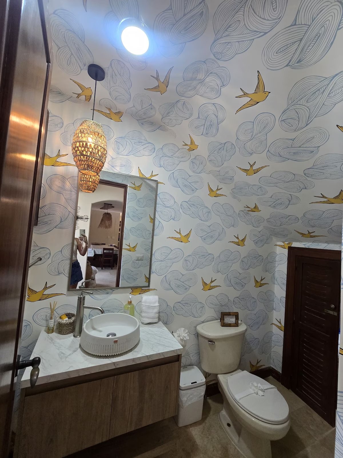 Fun half bath greets guest by the main entrance