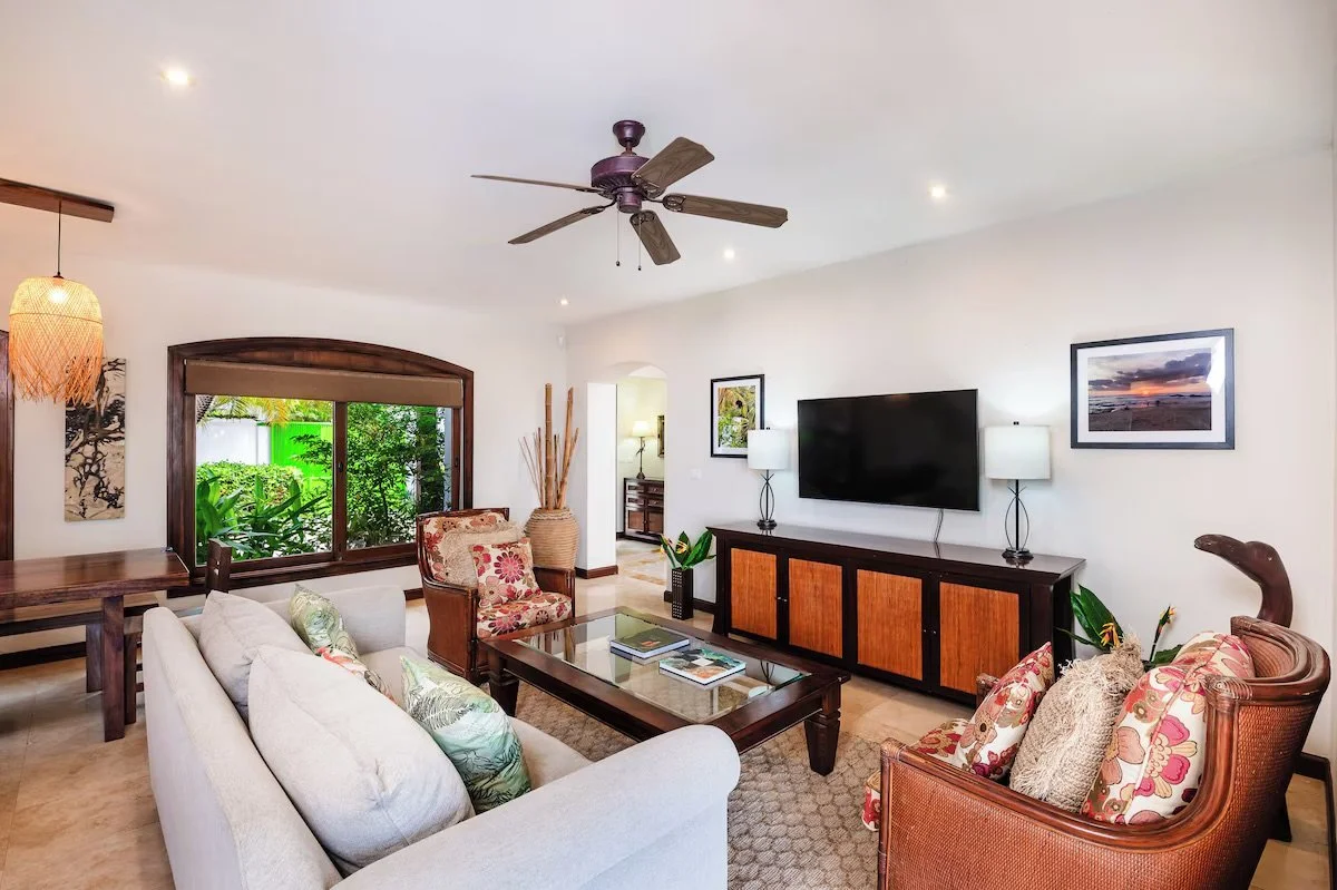 Living room with smart tv, games cabinet and pull out queen couch