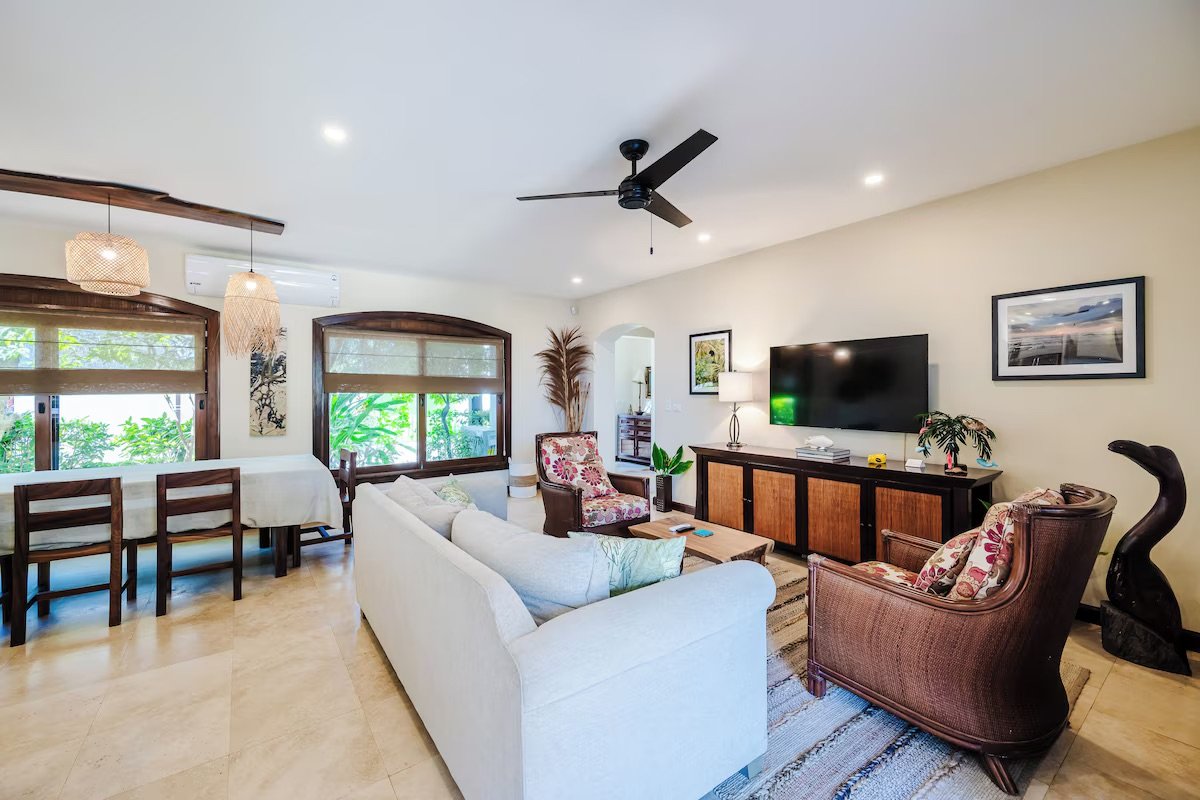 Living room with smart tv, games cabinet and pull out queen couch