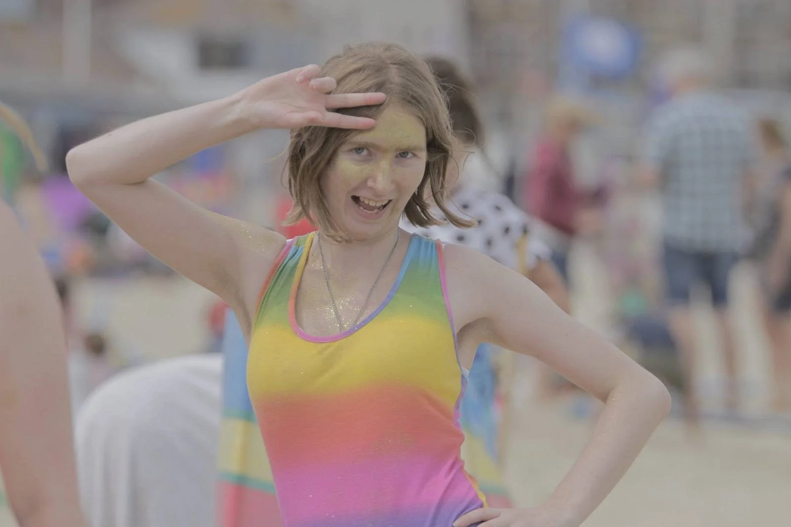 A younger pre-transition Ronald on the beach doing a Pride themed photo shoot, as shown at the start of the article. This time the rainbow dress he is wearing is full of colour again.
