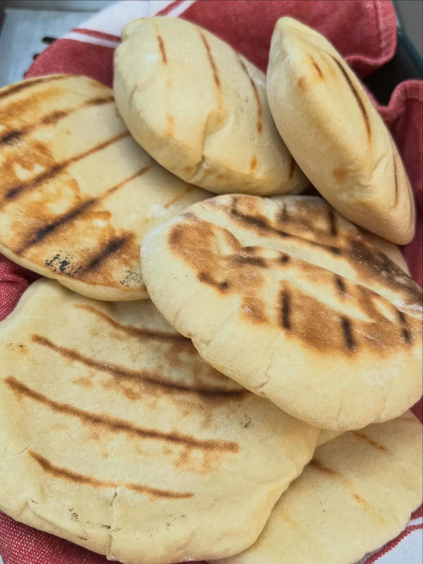 Fresh pita bread - yum! 3 cups flour (I like a mix of AP and whole wheat), 1 cup warm water, 1 tsp each sugar and salt, 1 tbs olive oil, and 2 and 1/4 tsp active dry yeast. Mix, knead for 10 min, leave to rise  for 1 hour. Divide into 8 parts and sha