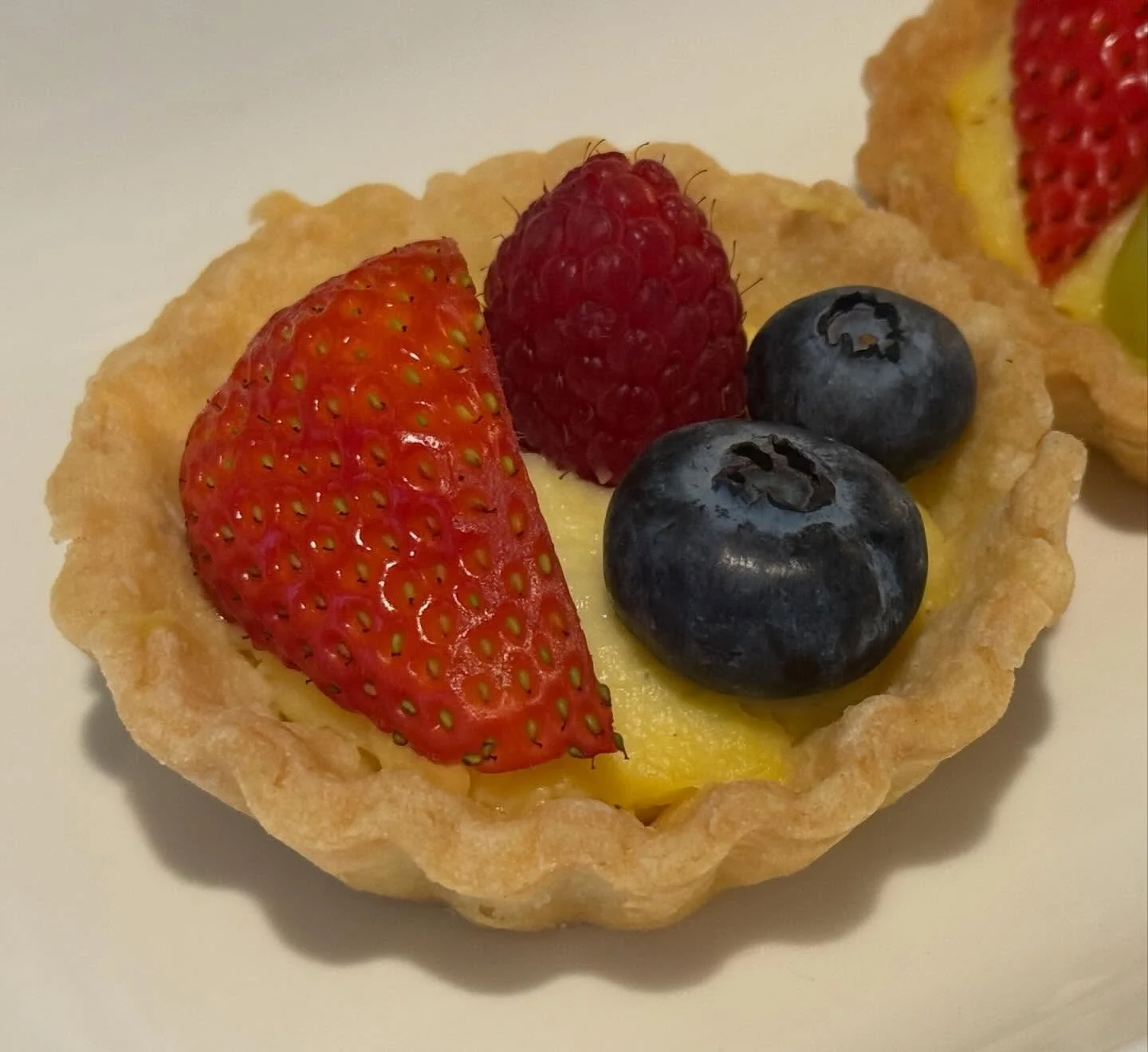 French p&acirc;te-sabl&eacute;e-based tartlets with traditional pastry cream are quite involved to make, but totally worth the time! Decadent.