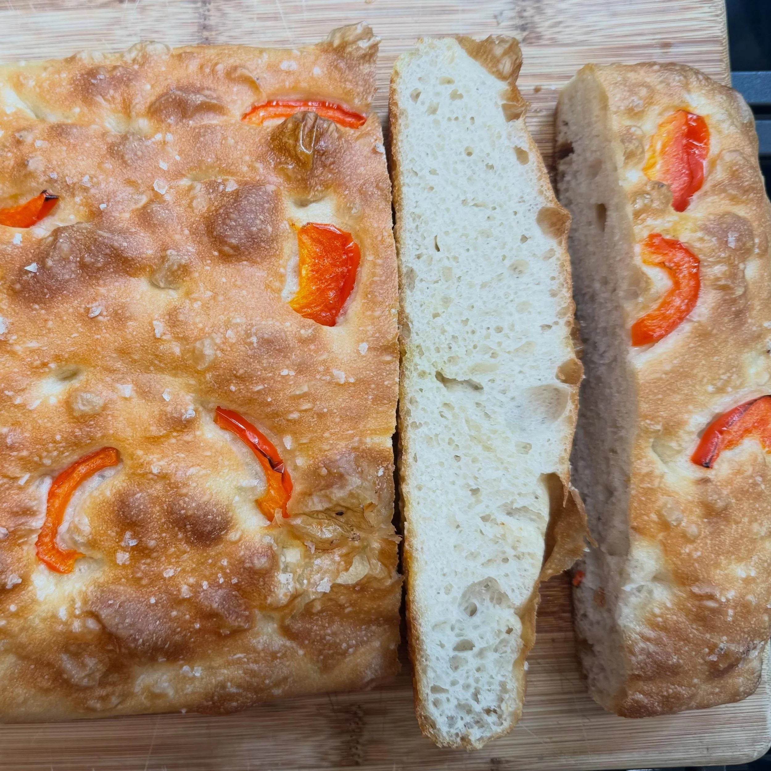 Focaccia: 500g bread flour, 460 ml warm water, 2 tsp salt, 2 tsp instant yeast. Mix, rest 30 min, knead lightly, proof for 2 hrs. Transfer to a baking pan, coat with 2-3 Tbs olive oil. Final proof- about 30 min. Dimple with oily fingers, add oiled in