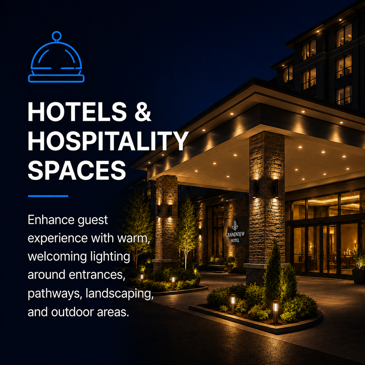 Night view of the entrance to a Grandview Hotel with warm lighting, brick columns, landscaped plants, and outdoor lighting.