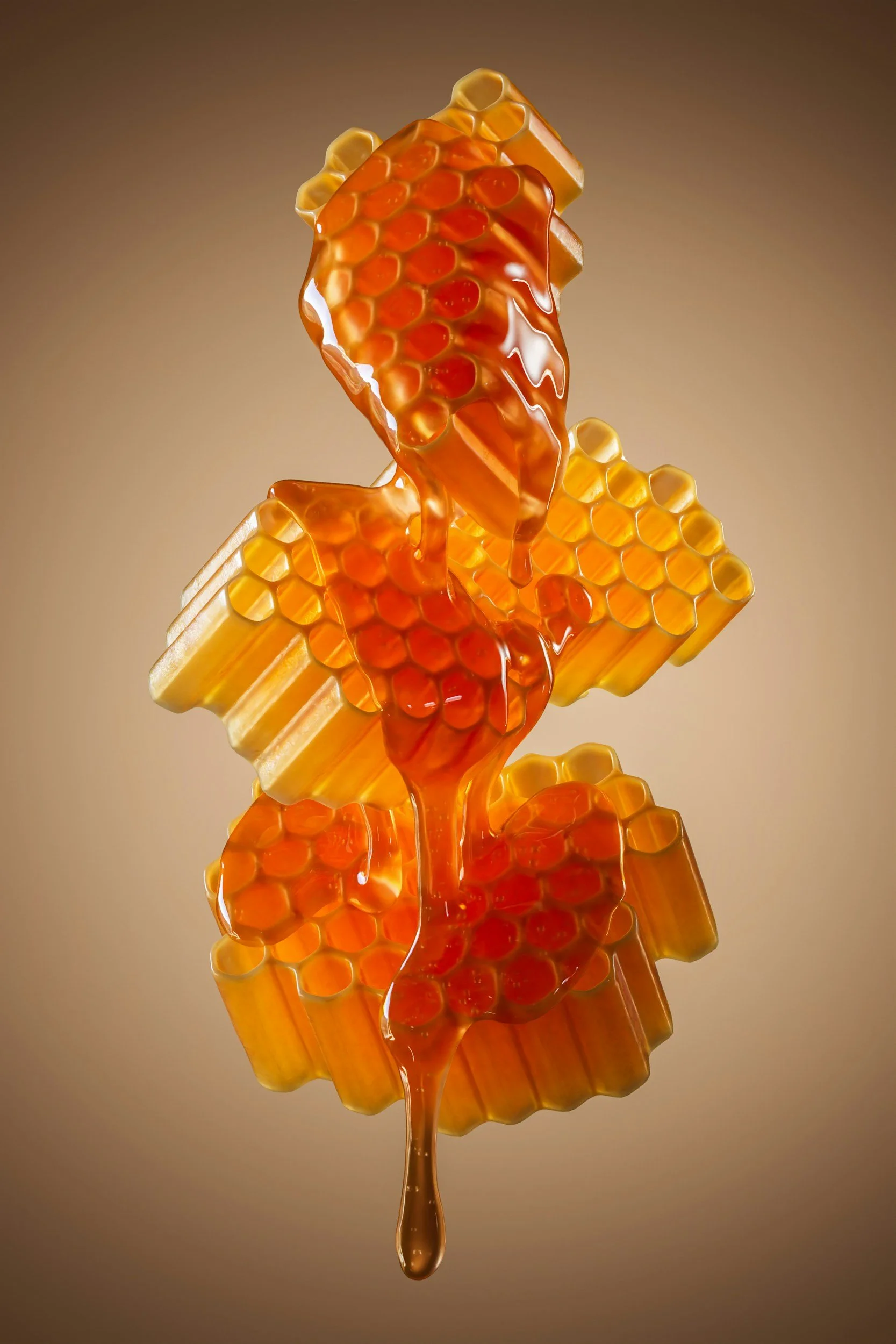 Close-up of honeycomb with honey dripping from it, set against a neutral background.