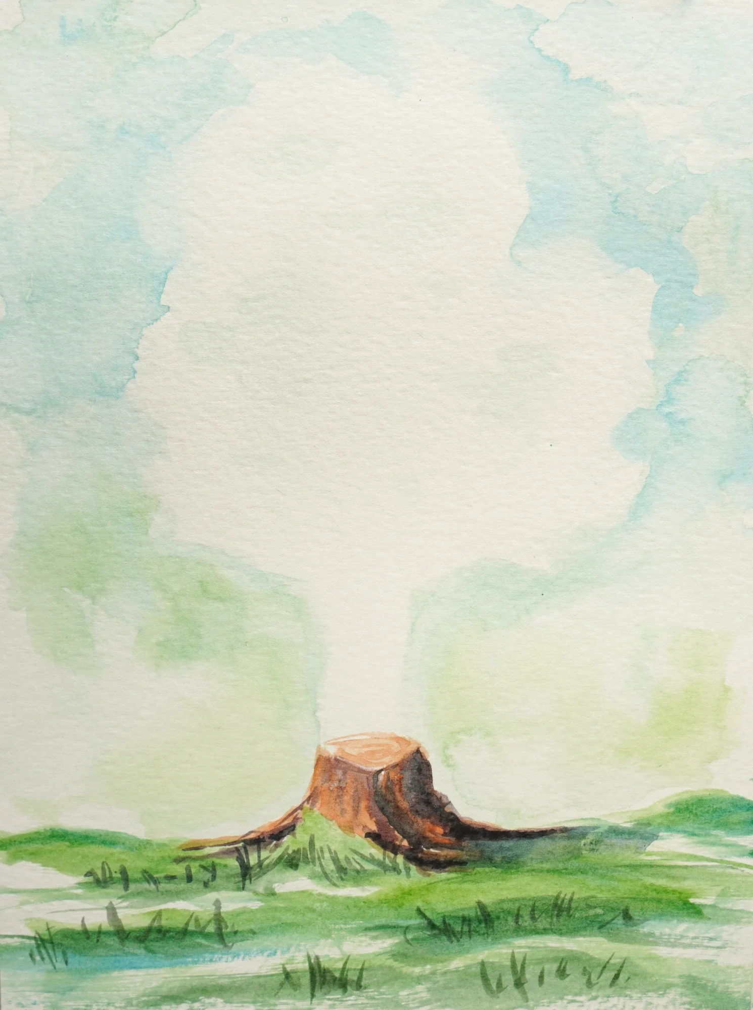 Watercolor painting of a tree stump in a grassy field with a soft blue and green sky in the background.