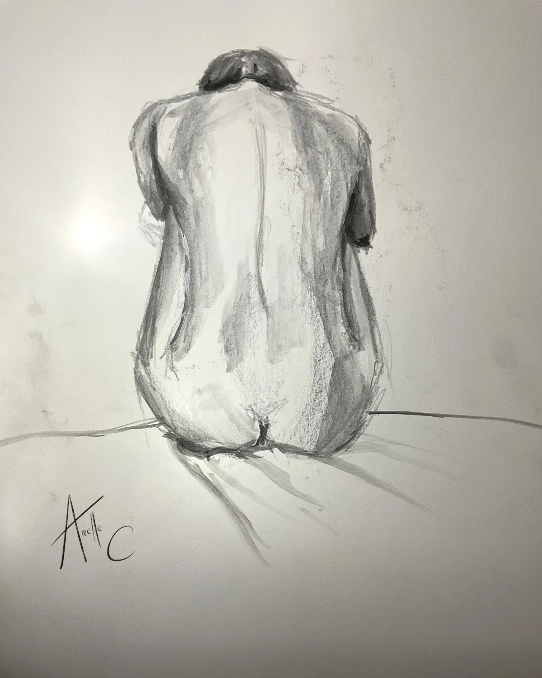 A black and white drawing of a nude woman sitting with her back to the viewer.