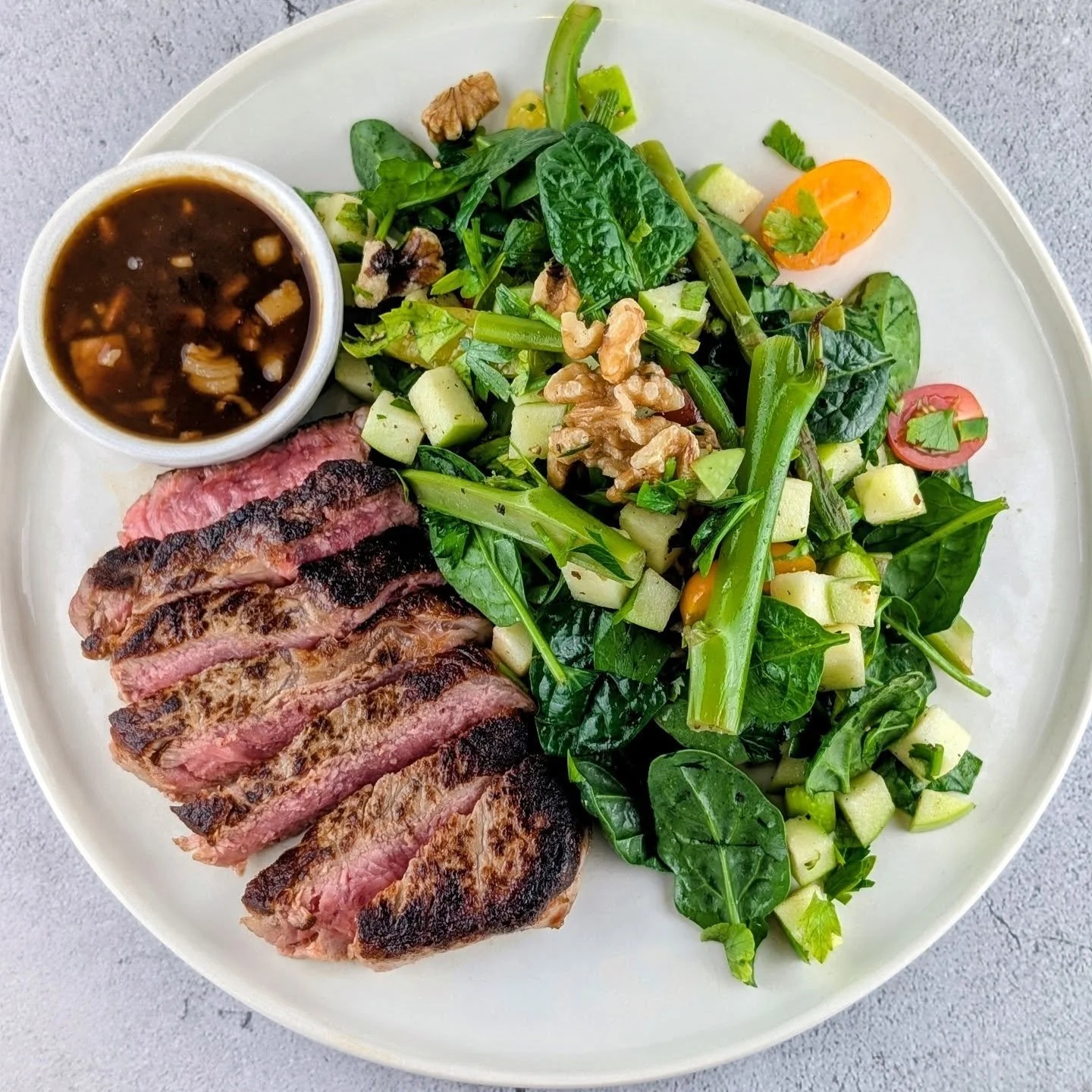Grass-Fed Beef Scotch Fillet paired with a Sauce Meurette made with our homemade Bone broth served with a baby spinach salad along with grilled asparagus &amp; Broccolini, apple &amp; walnuts.

At Artisan Meals Company, we prepare restaurant-quality,