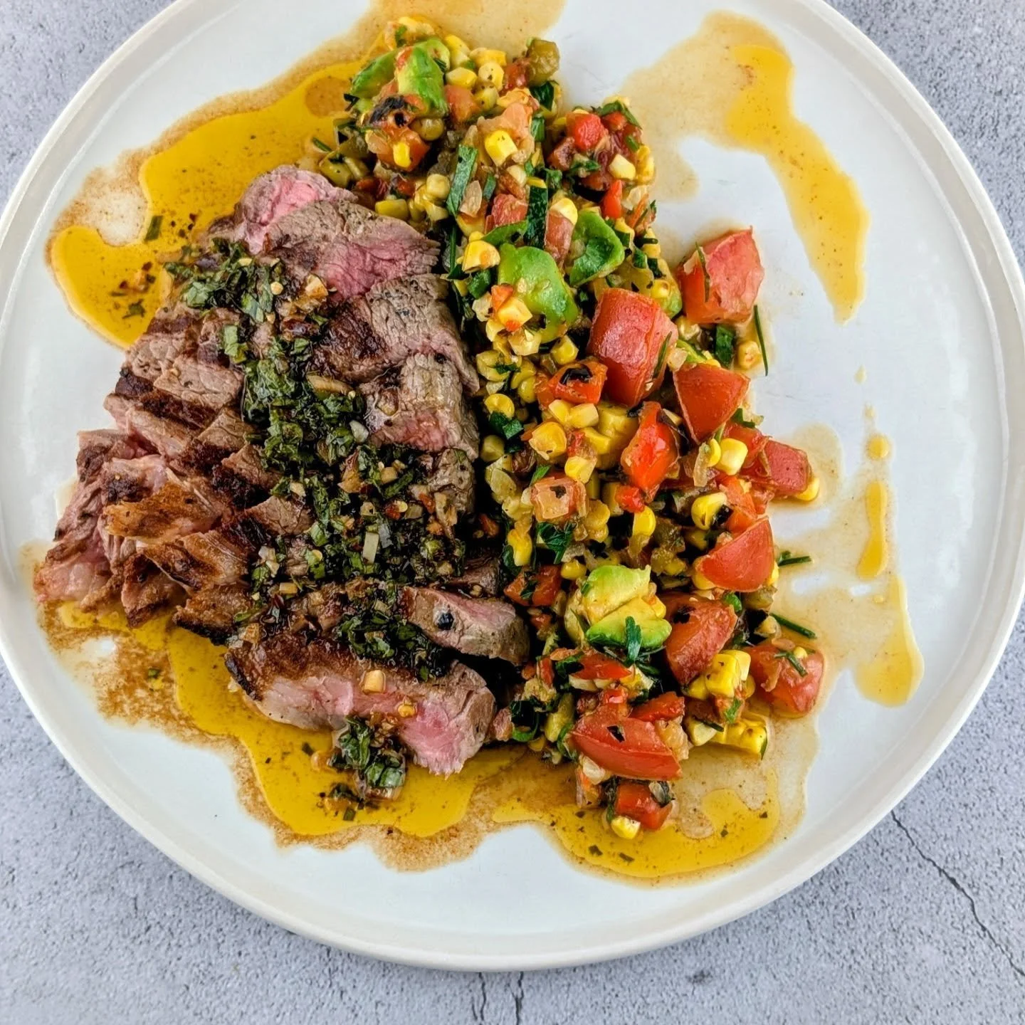 Grass-Fed Beef Rump served with a Capsicum Salsa with grilled capsicums, corn, echalote, onion, garlic, jalapeno and topped with fresh tomato and avocado finish with a nice big squeeze of lime and chopped coriander and parsley!

At Artisan Meals Comp