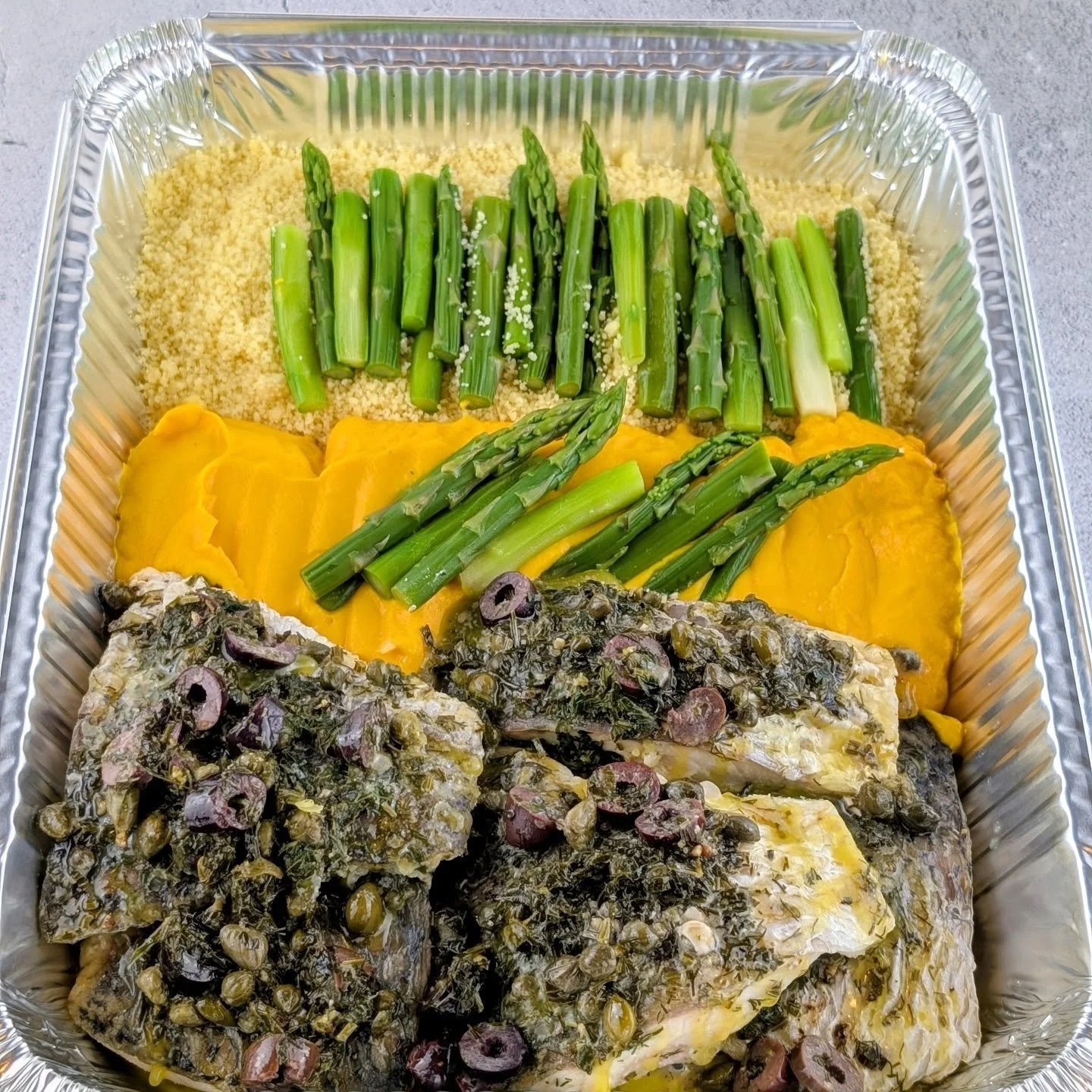 Barramundi done right!

Fresh, flaky barramundi with capers, olives &amp; herbs, finished with rich hazelnut butter. Served with vibrant steamed asparagus, fluffy couscous, and a silky carrot pur&eacute;e &mdash; this is comfort food with a refined e