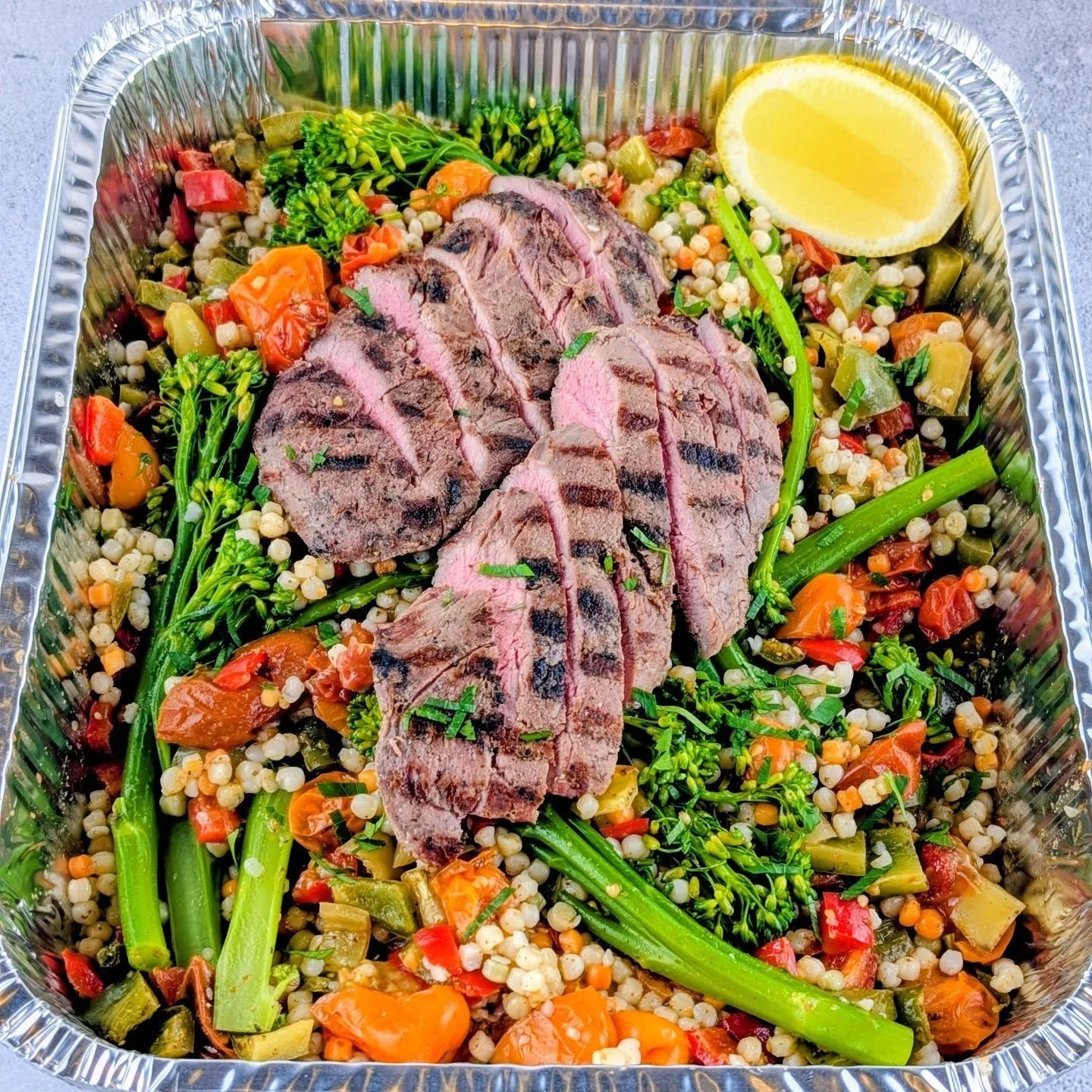 🍽️ Today&rsquo;s Personalised Meal

Sous-vide Lamb Backstrap served with grilled broccolini, roasted cherry tomatoes and zucchini seasoned with Za&rsquo;atar and Sumac, roasted bullhorn capsicums, pearl couscous, and fresh herbs, finished with our h