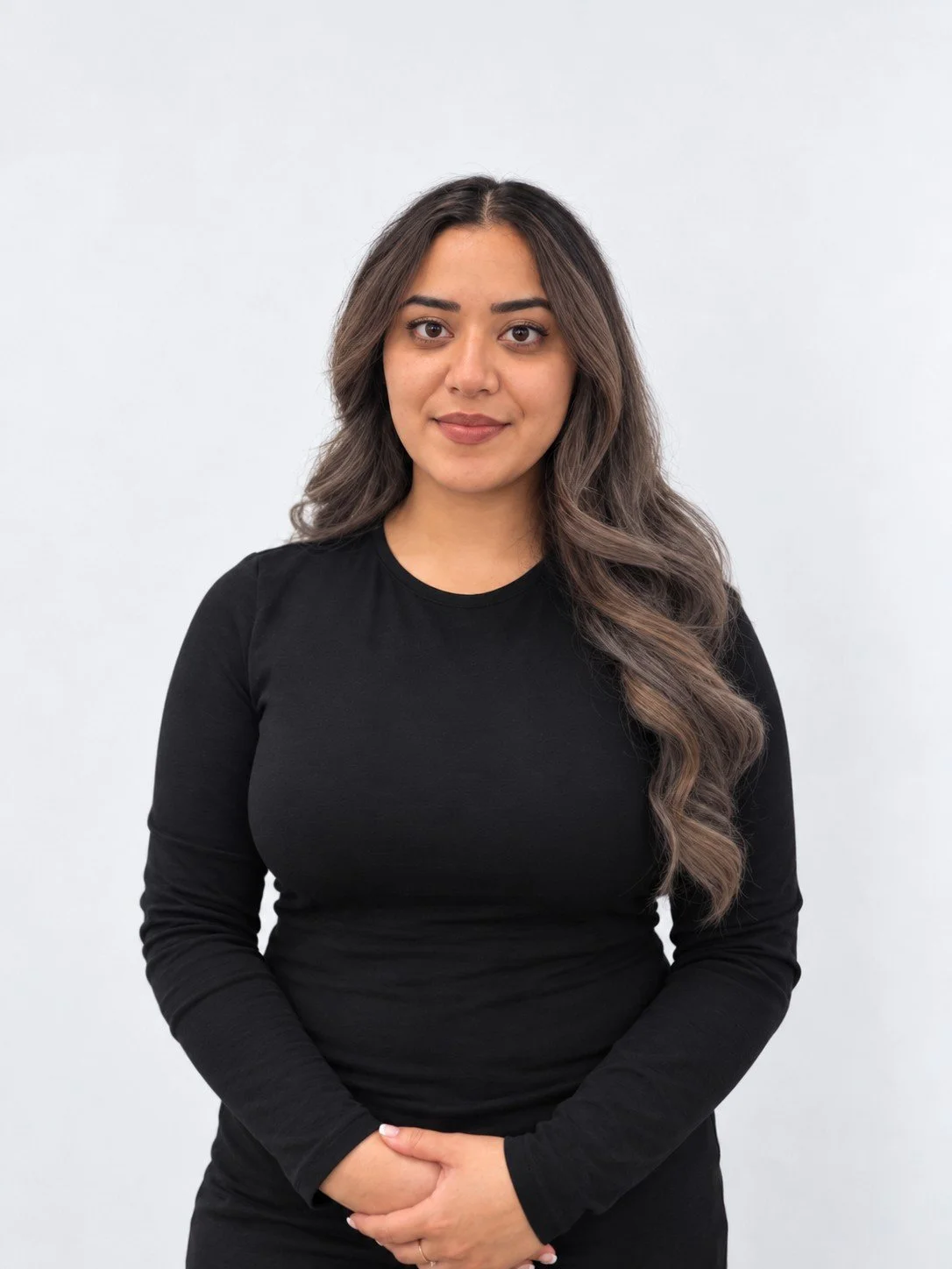 Gitika Standing in black top smiling towards camera near me therapy physio