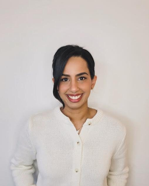 sonia dhillon counseller in white sweater, smiling head on in langley bc