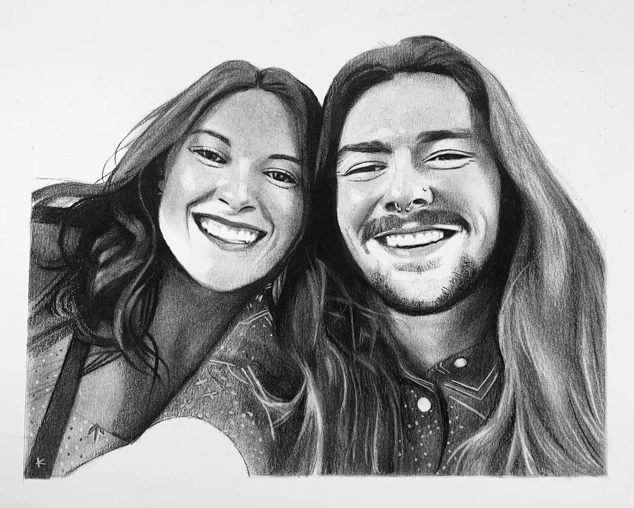 Black and white pencil drawing of a smiling woman and man with long hair, both facing forward.