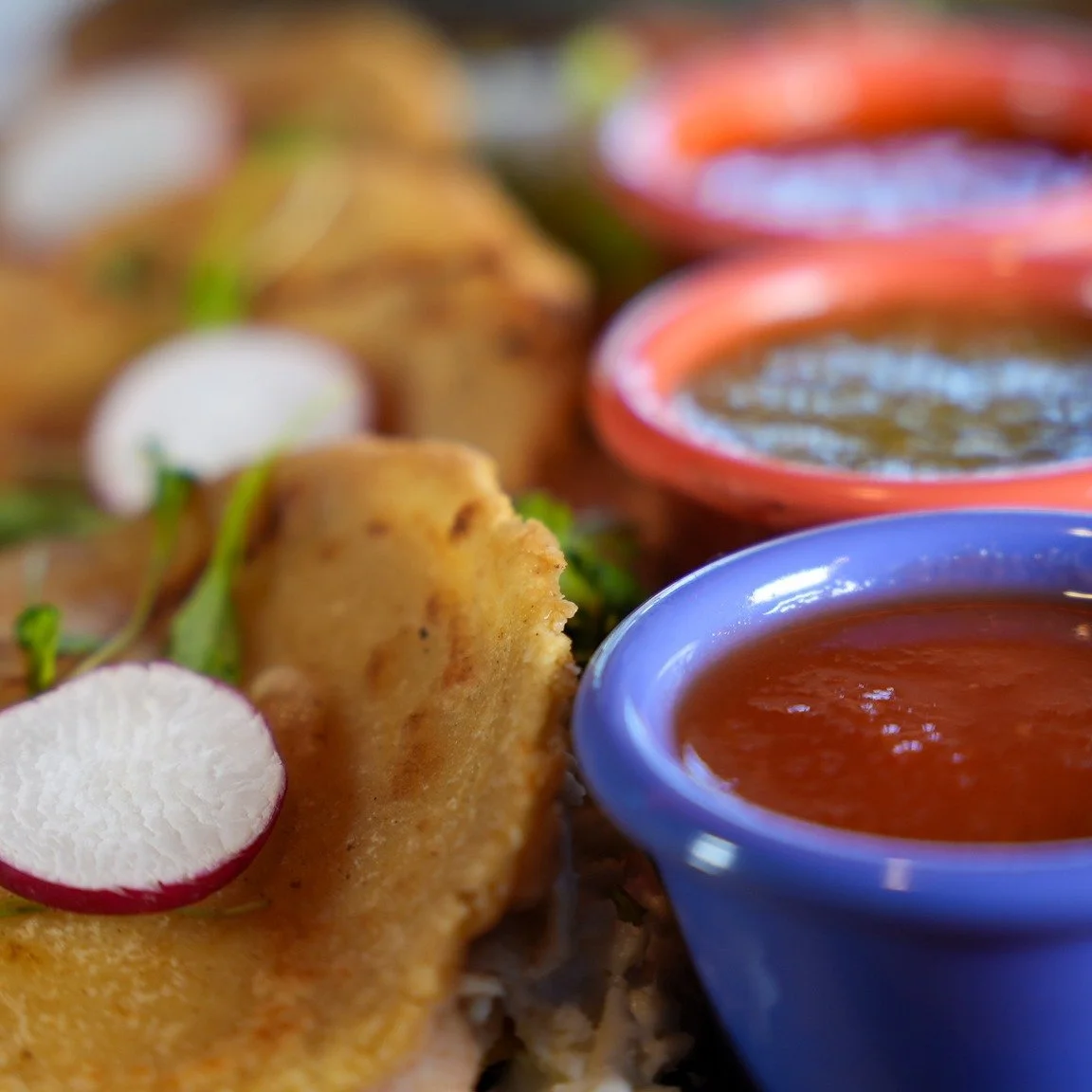 **WEEKEND SPECIAL**

Handmade circular masa pockets, crisp on the outside and soft within, generously stuffed with your choice of slow-simmered refried beans, smoky chicken tinga, or seasoned ground beef. Each gordita is paired with a trio of house s