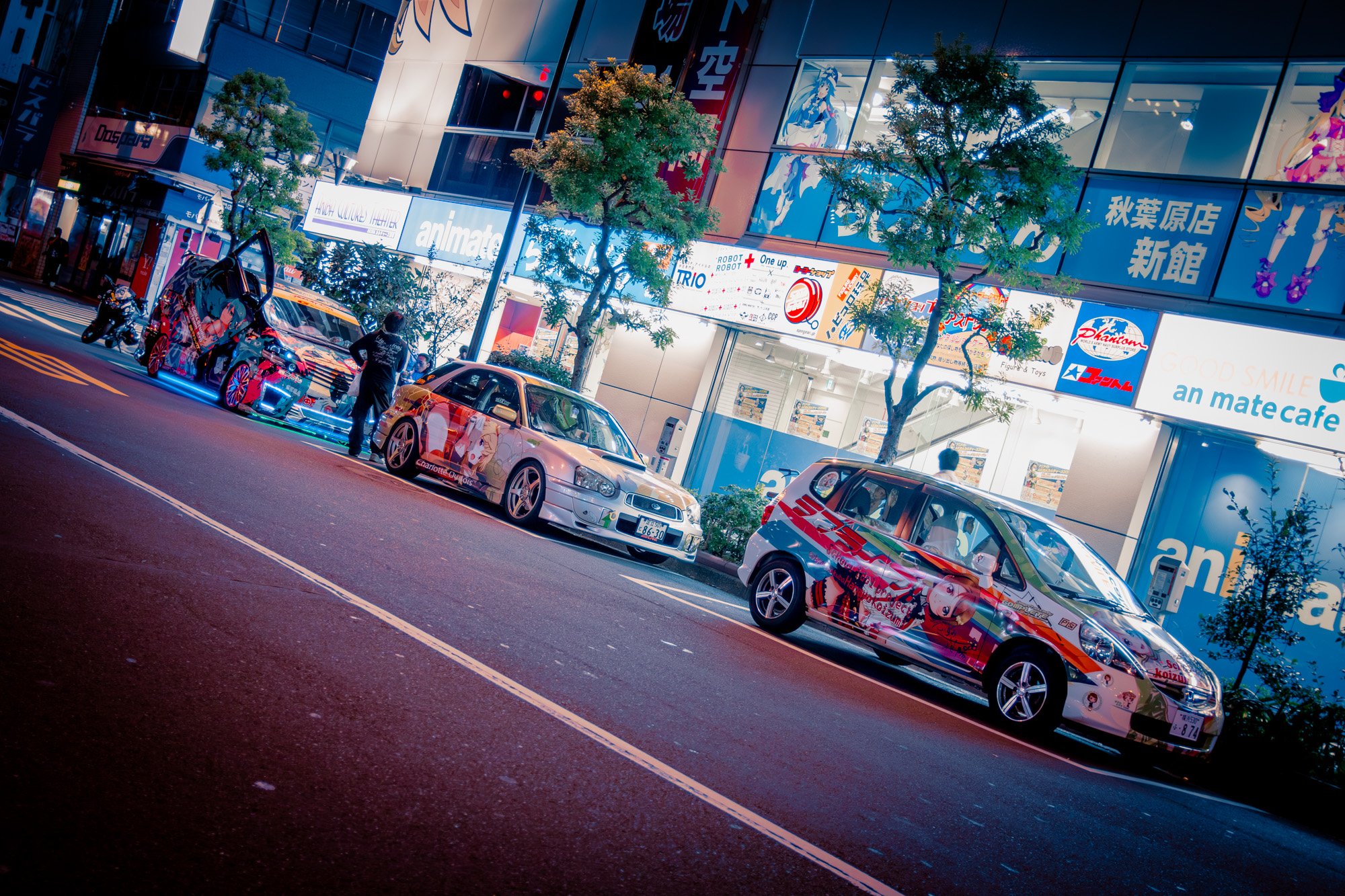 Itasha parked along an Akihabara street.