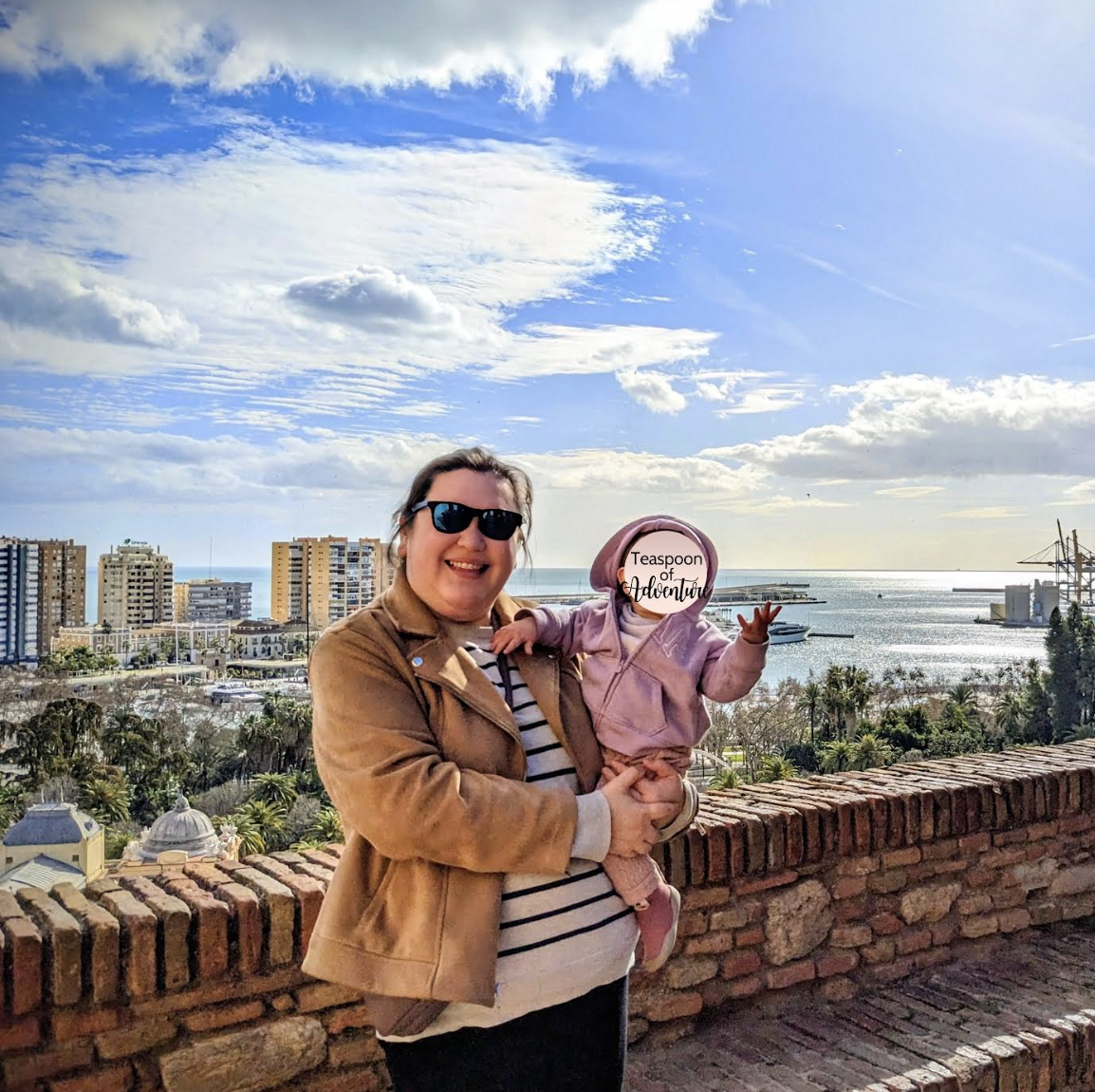 Riana holding her baby in Spain