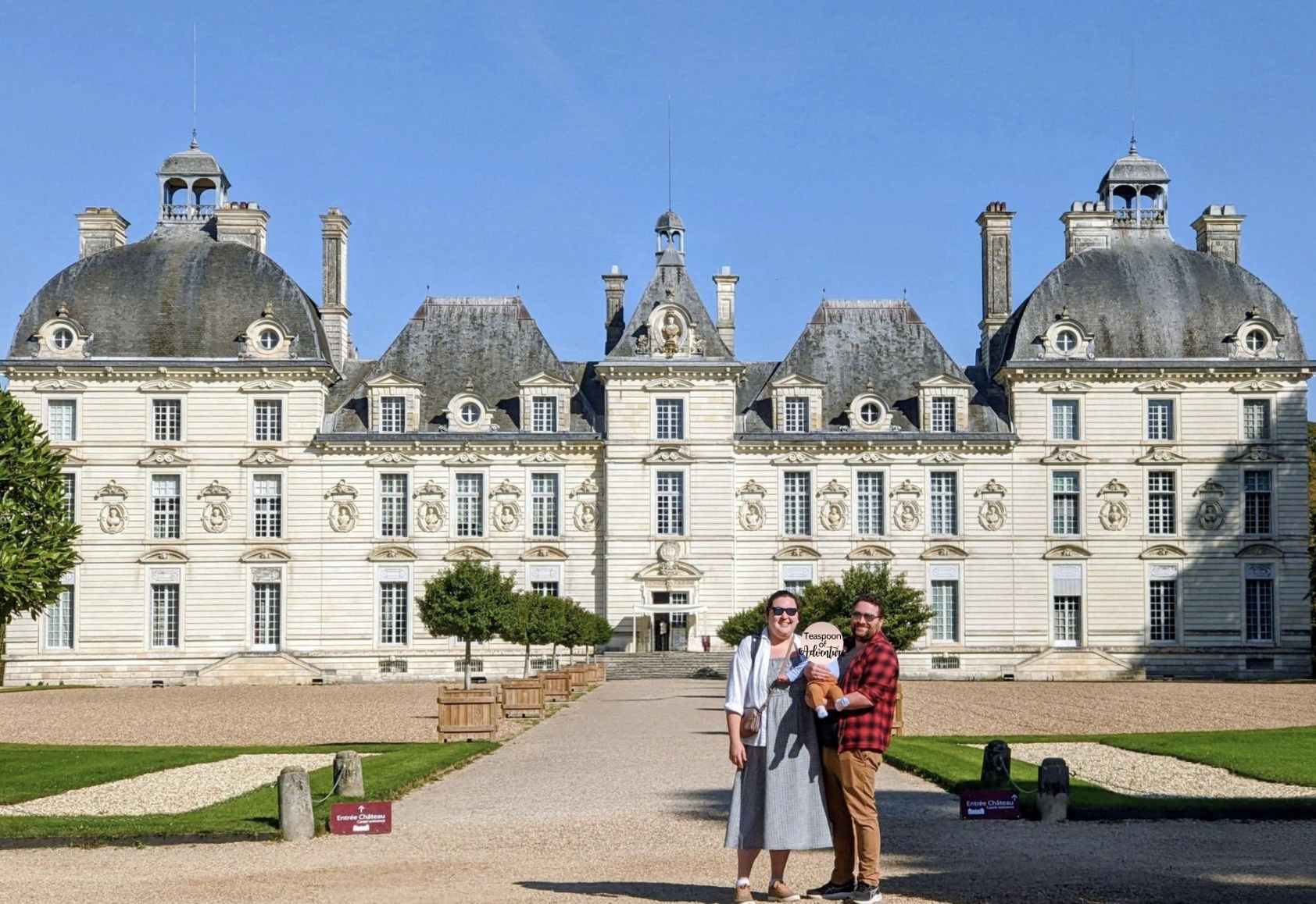 Riana and her family standing in front of a palace