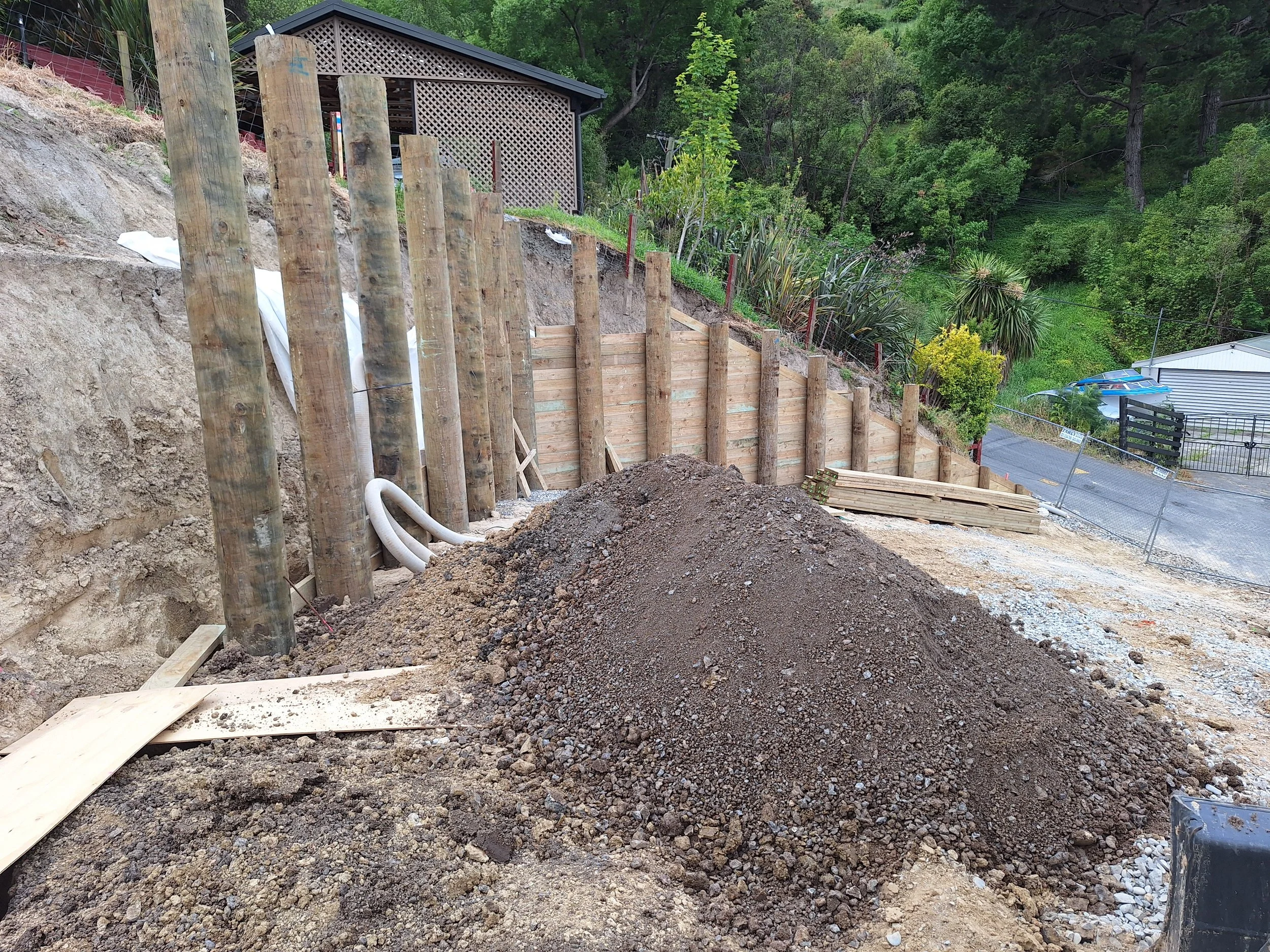 Sloped timber retaining wall.