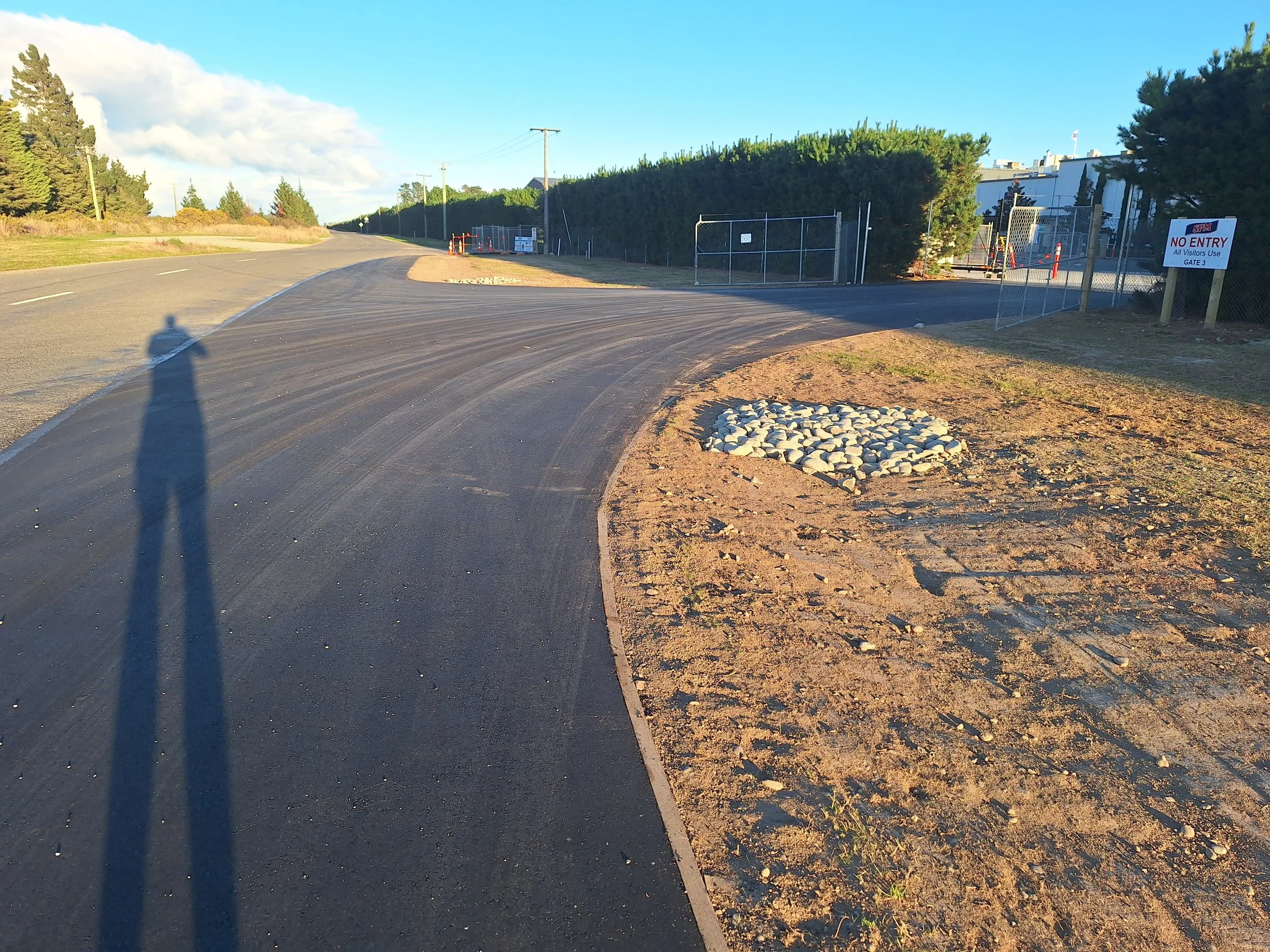 Commercial asphalt entranceway.
