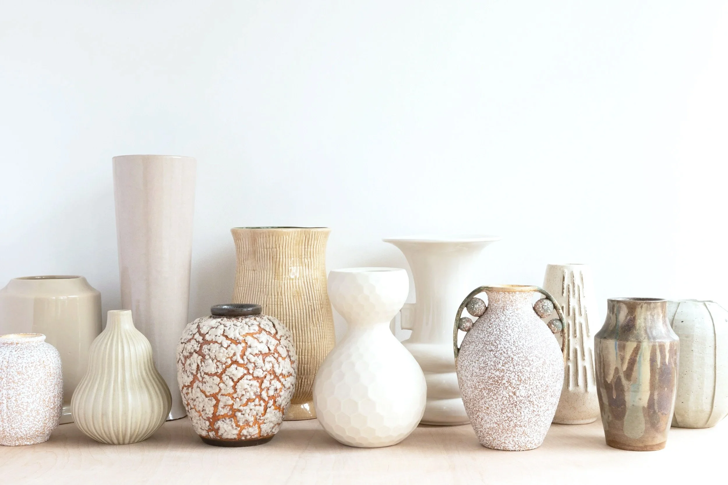 Vases and pots of different heights and styles