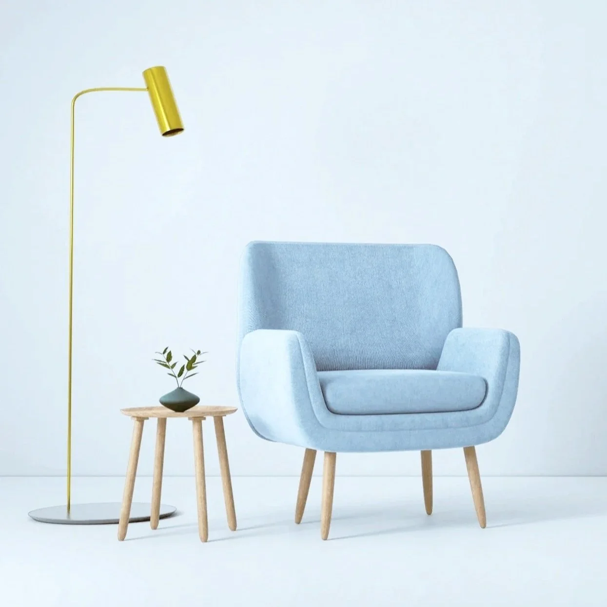 Blue armchair beside a small table and floorlamp