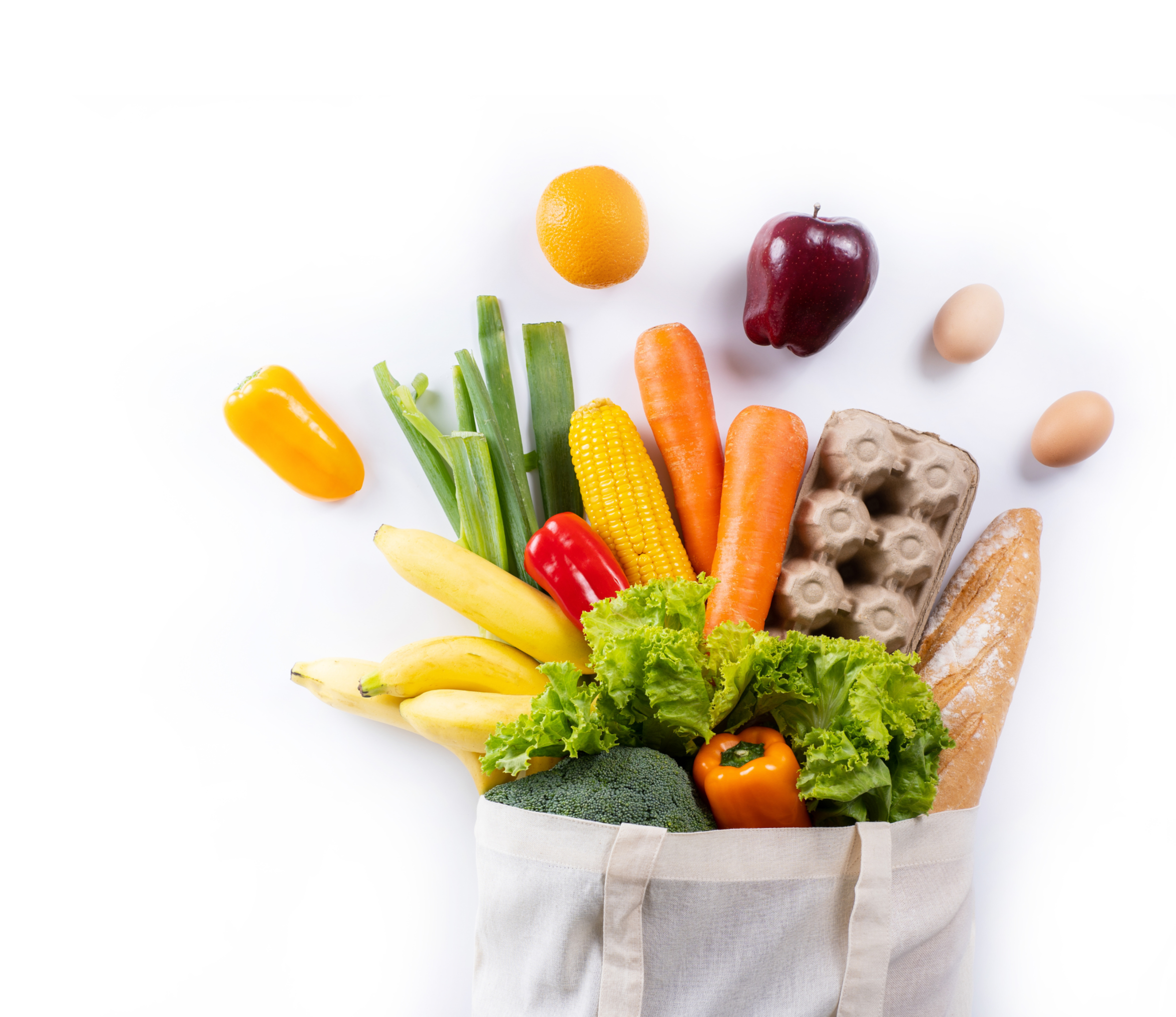 Grocery bag with vegetables and eggs