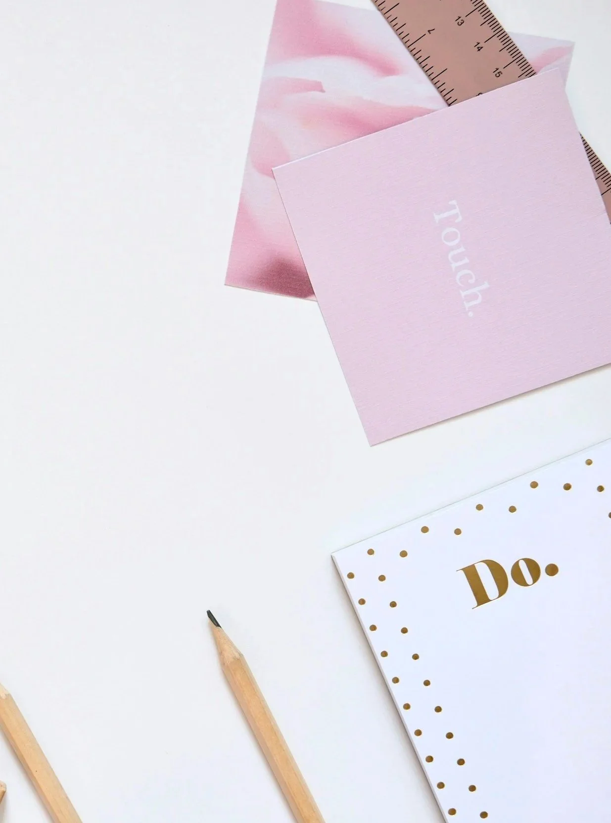 Pink and white stationary on Your Coach Terri, LLC from UnSplash