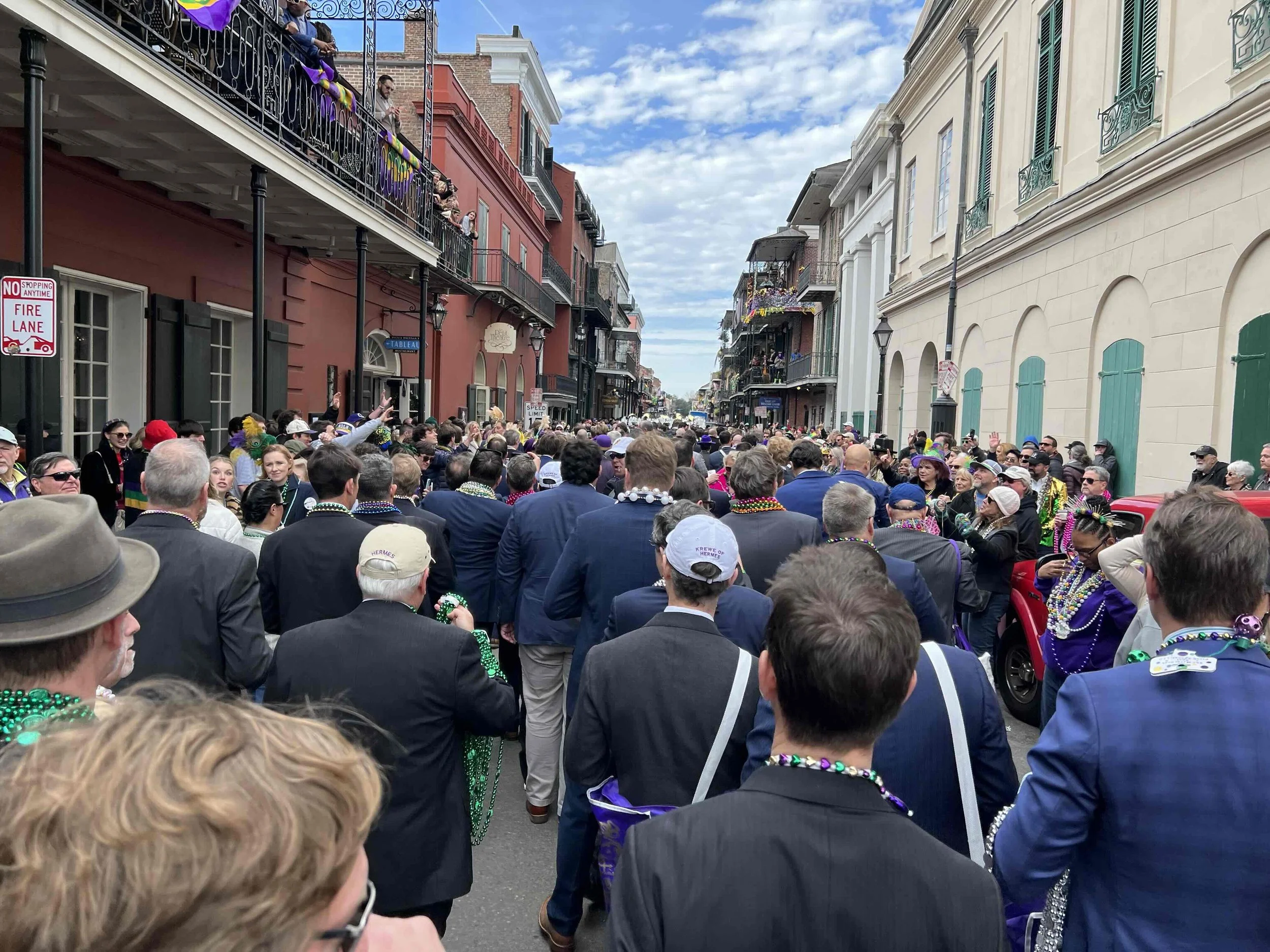 Members of the Mystic Krewe of Hermes marching in the French Quarter in New Orleans.