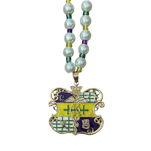 A gold medal with a purple and green ribbon and a decorative crest in the center.