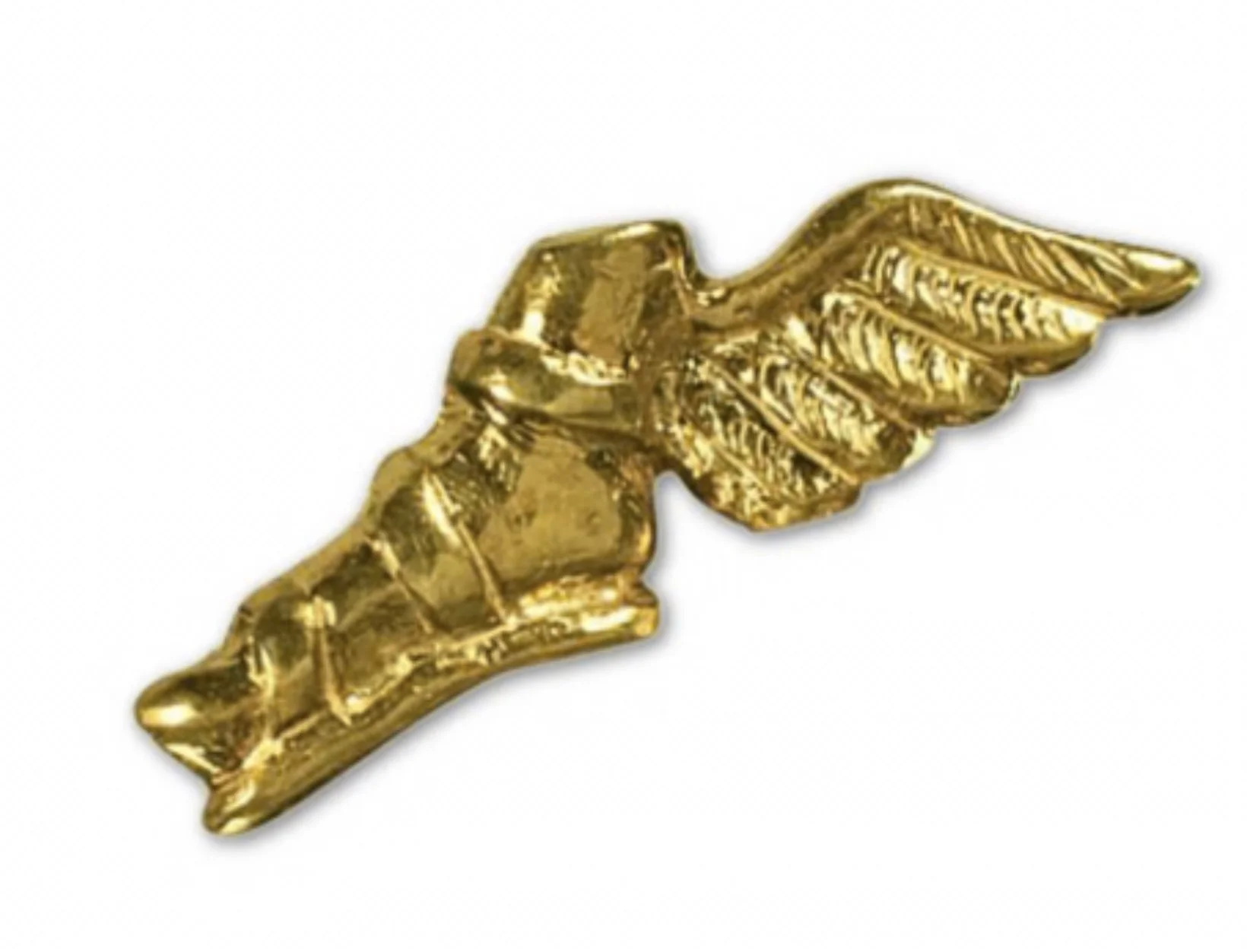 Gold-colored decorative object shaped like a hand with a pointing finger and wing details.