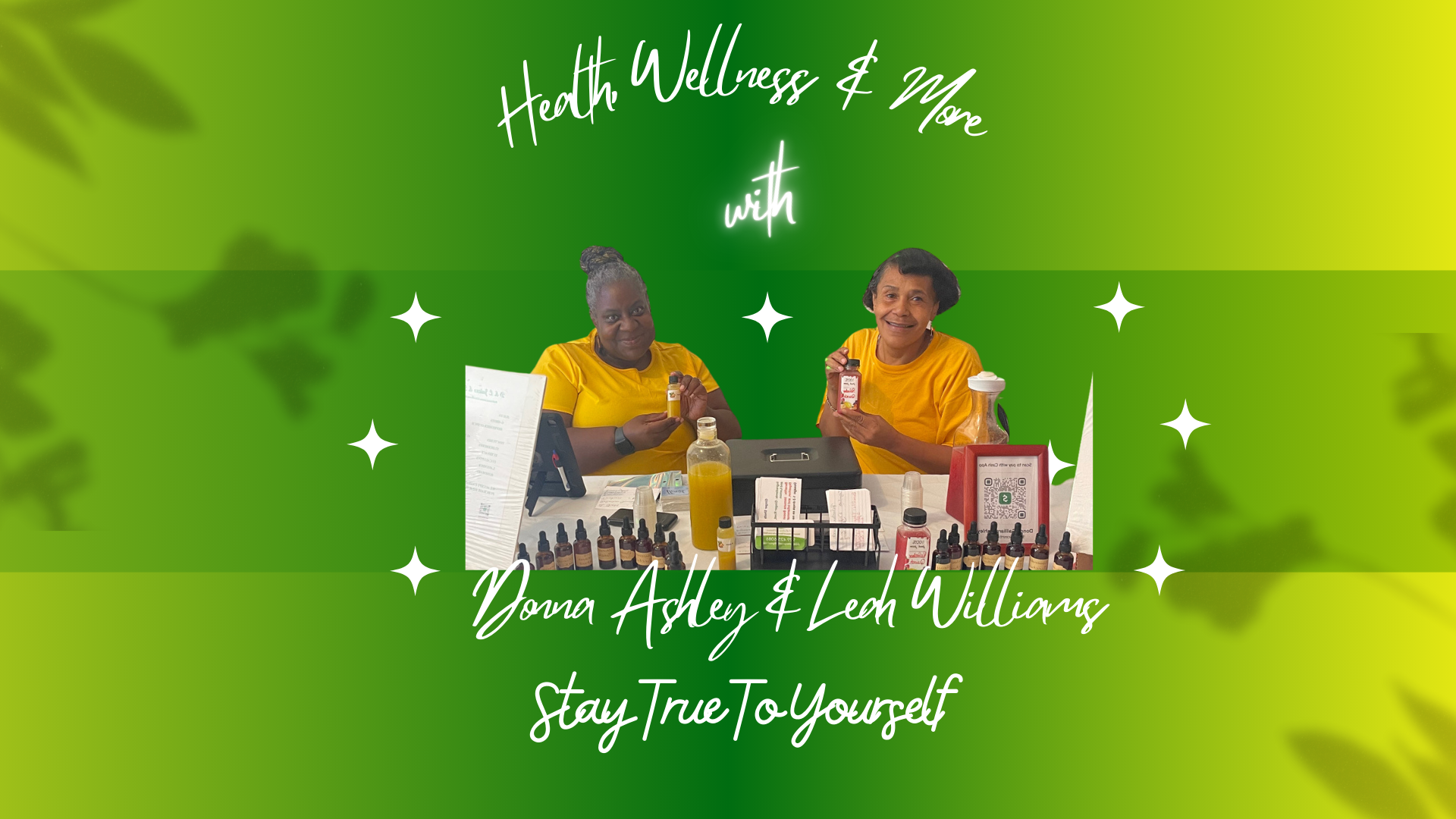 Two women wearing yellow shirts sitting behind table with health and wellness products, including bottles and dropper bottles, with a text reading 'Health, Wellness & More with Donna Ashley & Leah Williams Stay True To Yourself'.