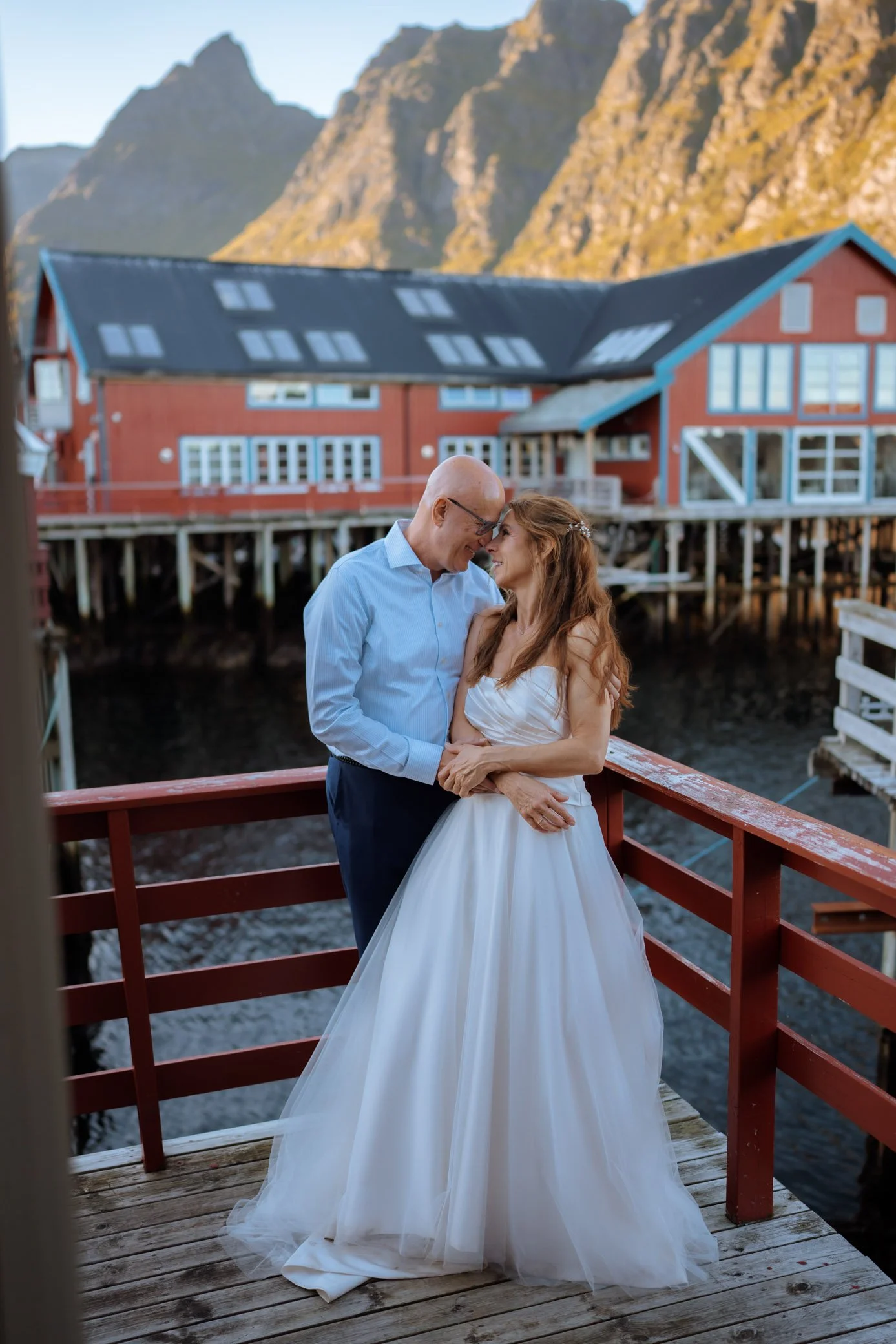 Couple enjoying quiet morning outside rorbuer in Lofoten Norway