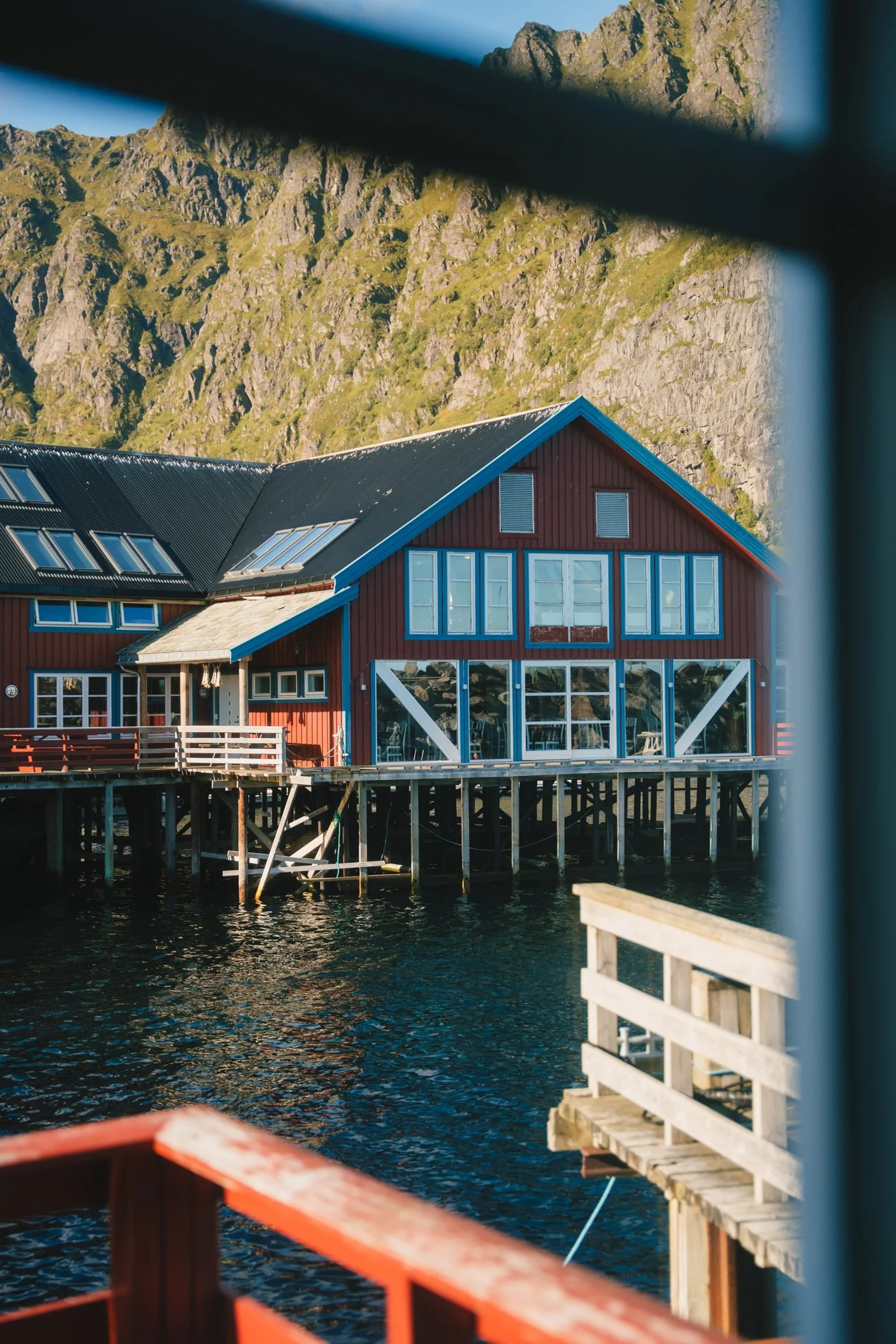View from rorbuer window with mountains and water in Lofoten