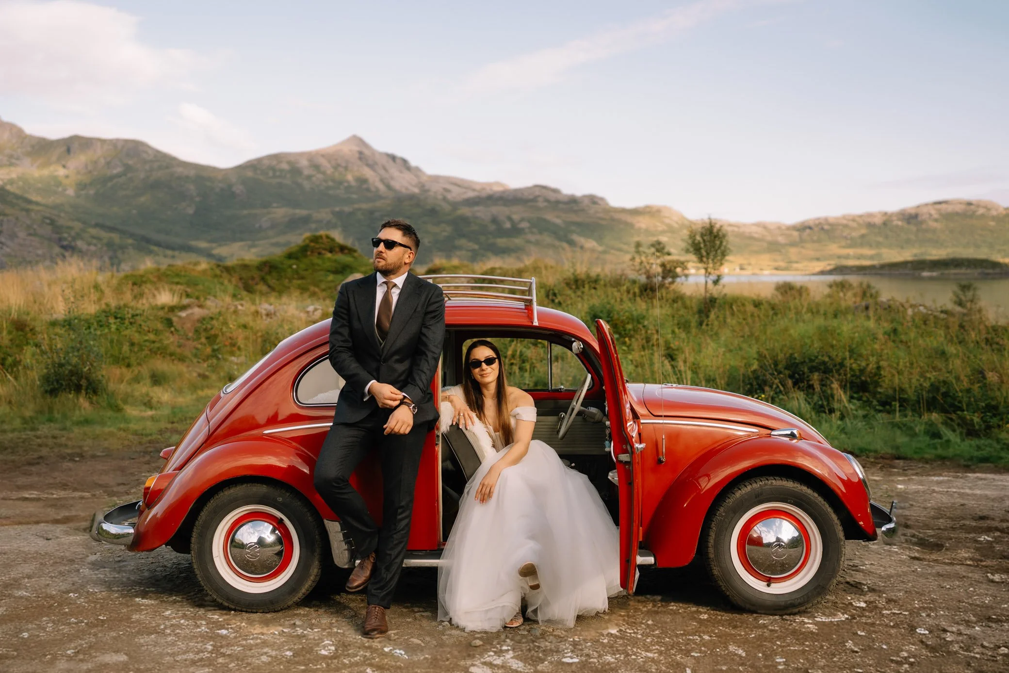Couple at viewpoint on the road to Nusfjord during Lofoten elopement 