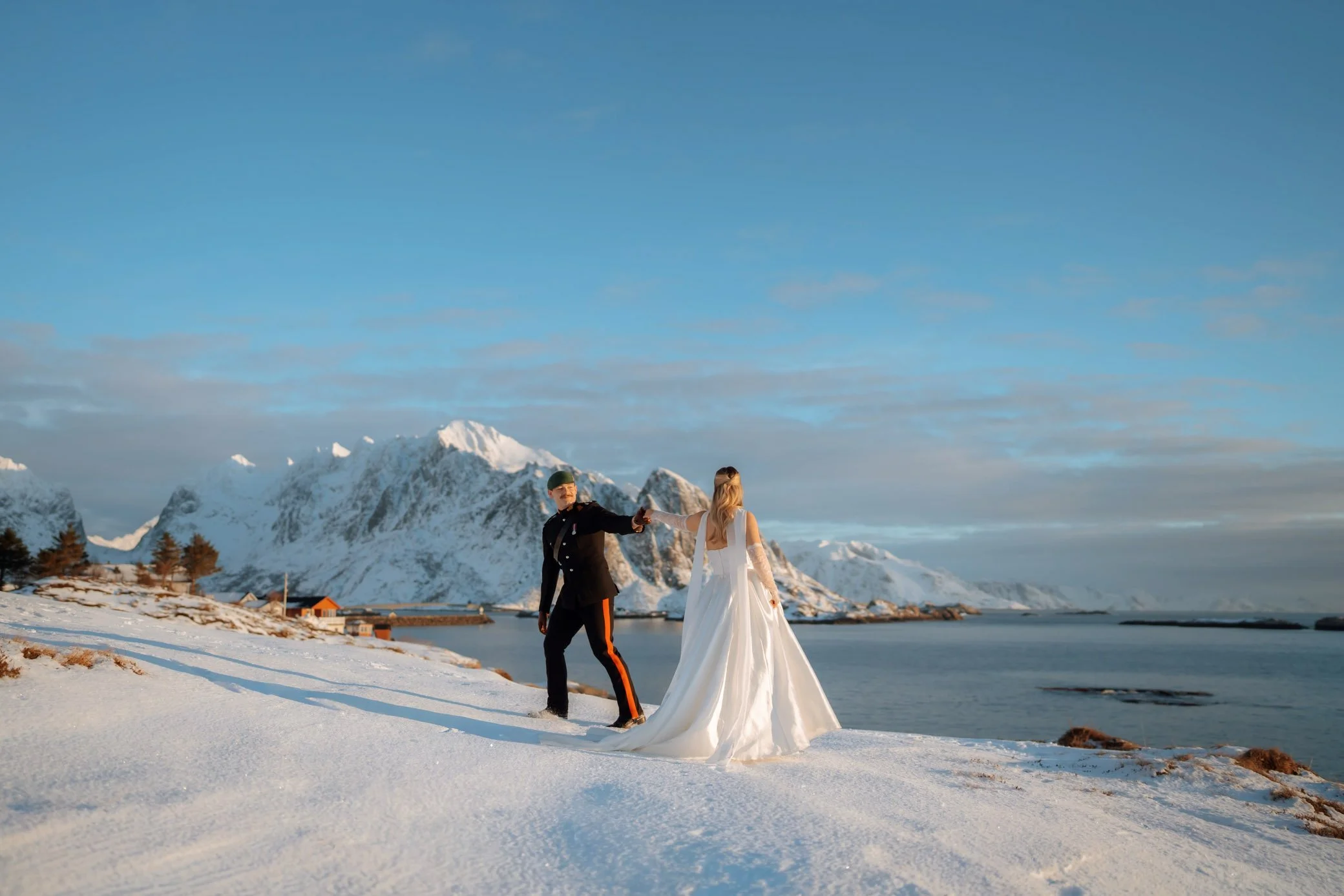 Couple standing on beach during Lofoten elopement in Norway