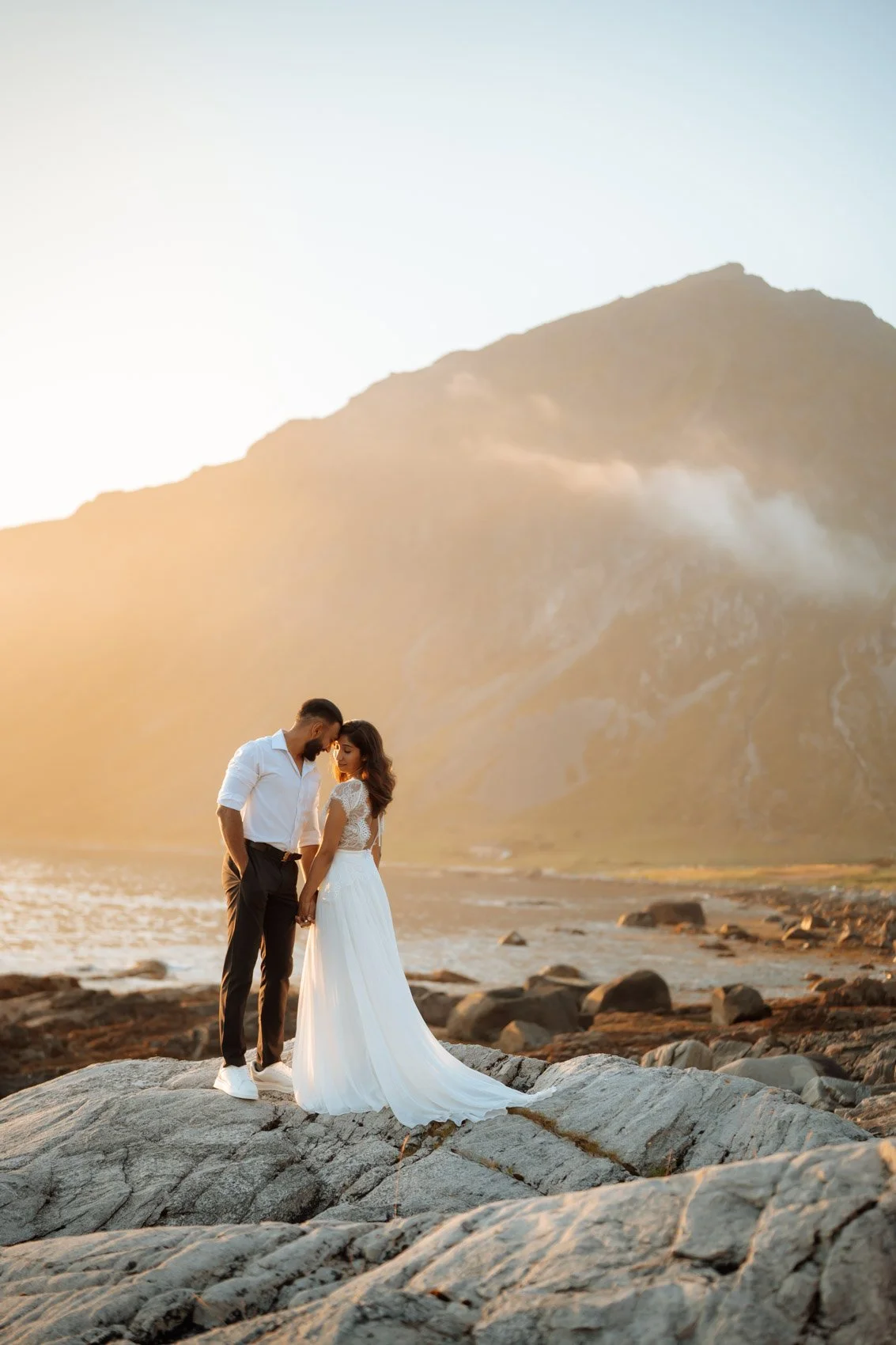 Outdoor wedding ceremony in Lofoten with dramatic mountain backdrop