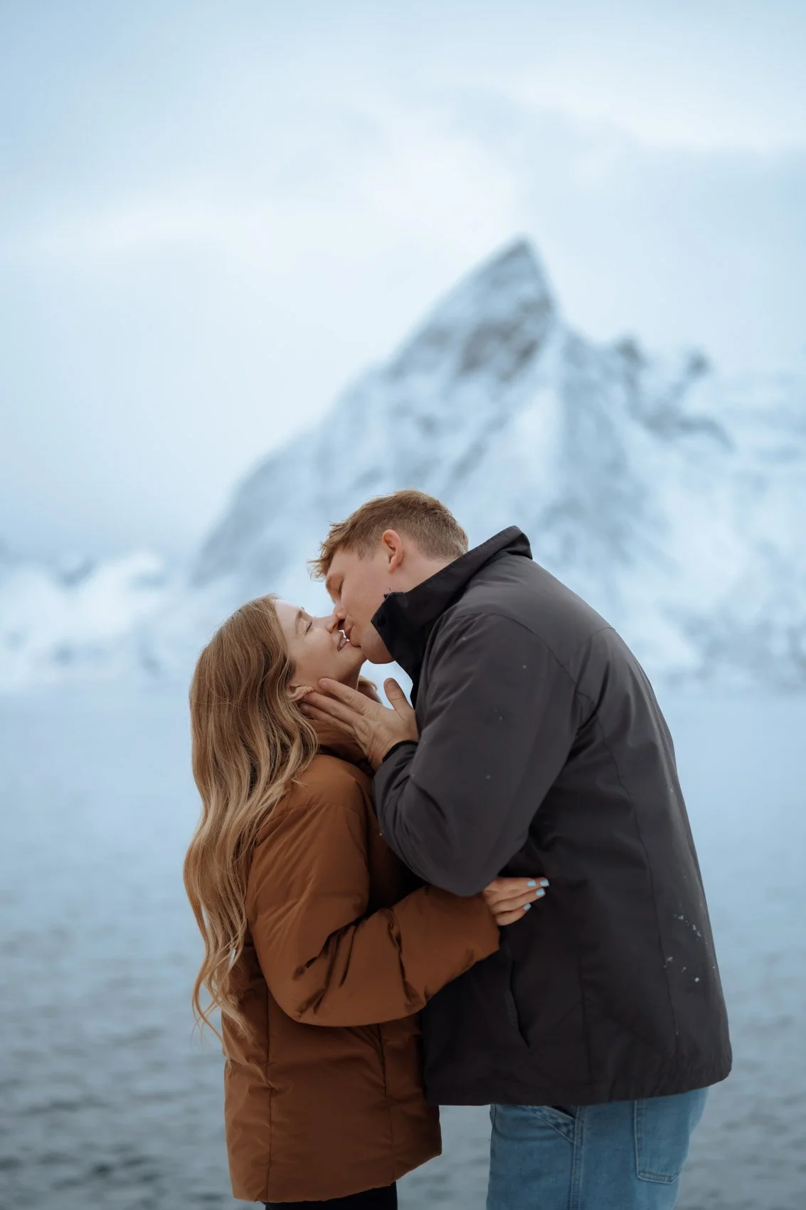 Winter coastline in Lofoten with snow and sea