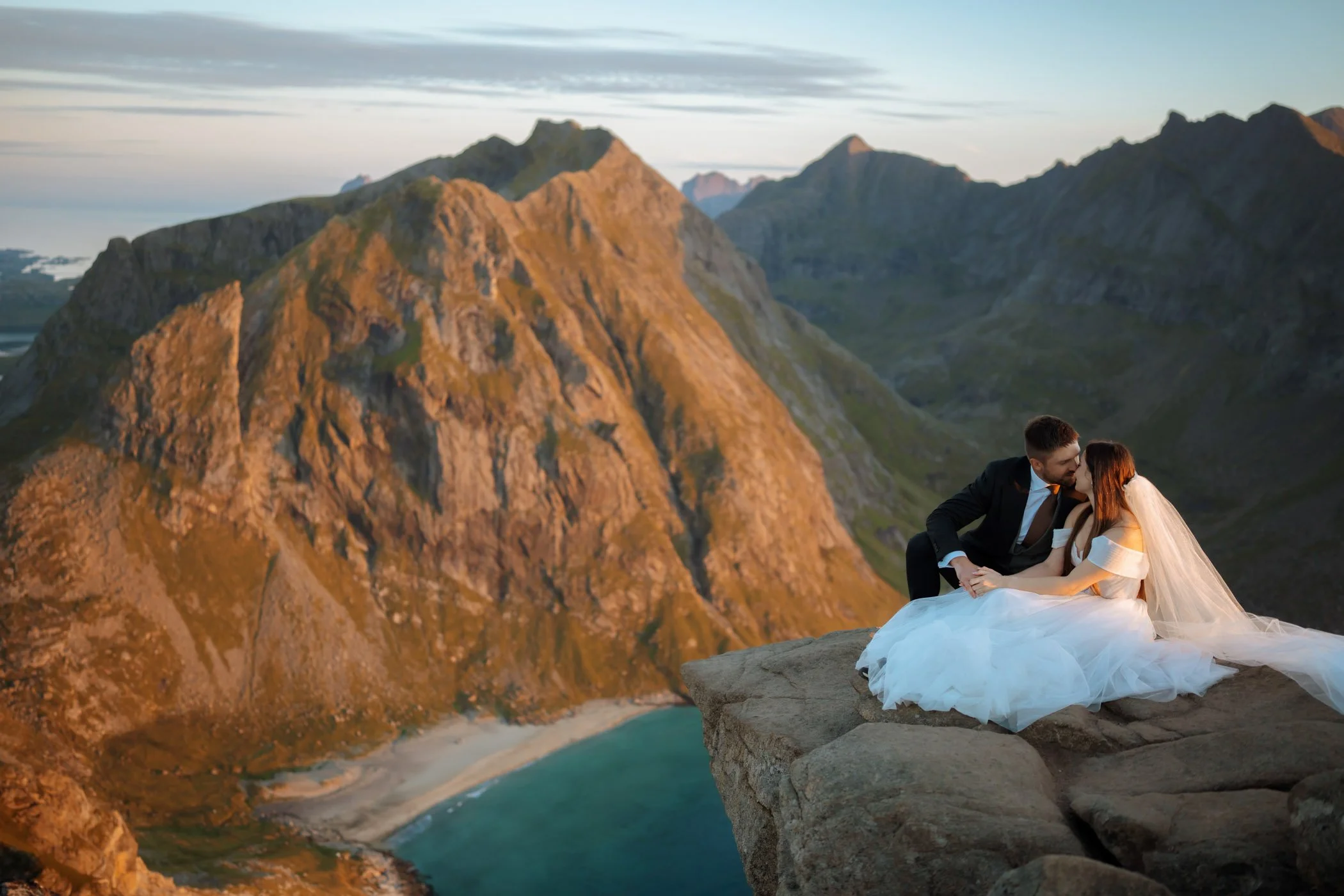 Outdoor wedding ceremony in Lofoten with dramatic mountain backdrop